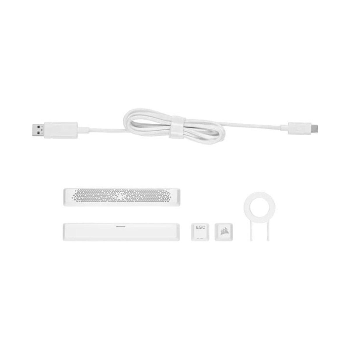 Weißes Ladekabel und Zubehör. Enthält USB-Kabel, Tastaturtasten und ein Reinigungswerkzeug.