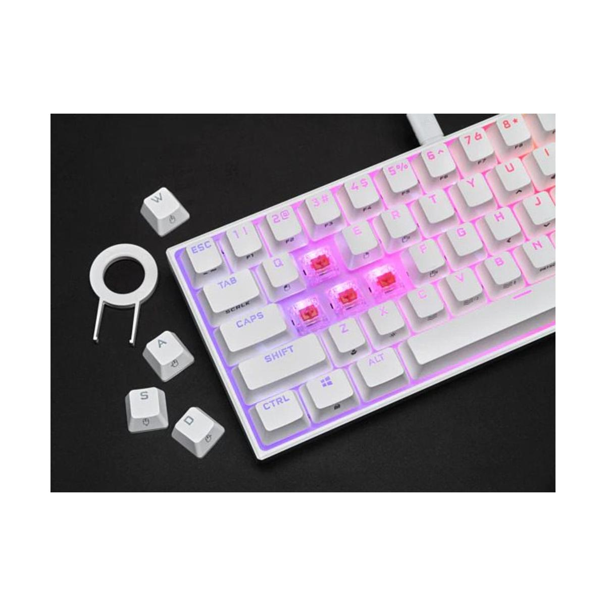 Weiße Tastatur mit rot beleuchteten Tasten. Einige Tastenkappen sind entfernt und ein Tastenkappenabzieher ist enthalten.