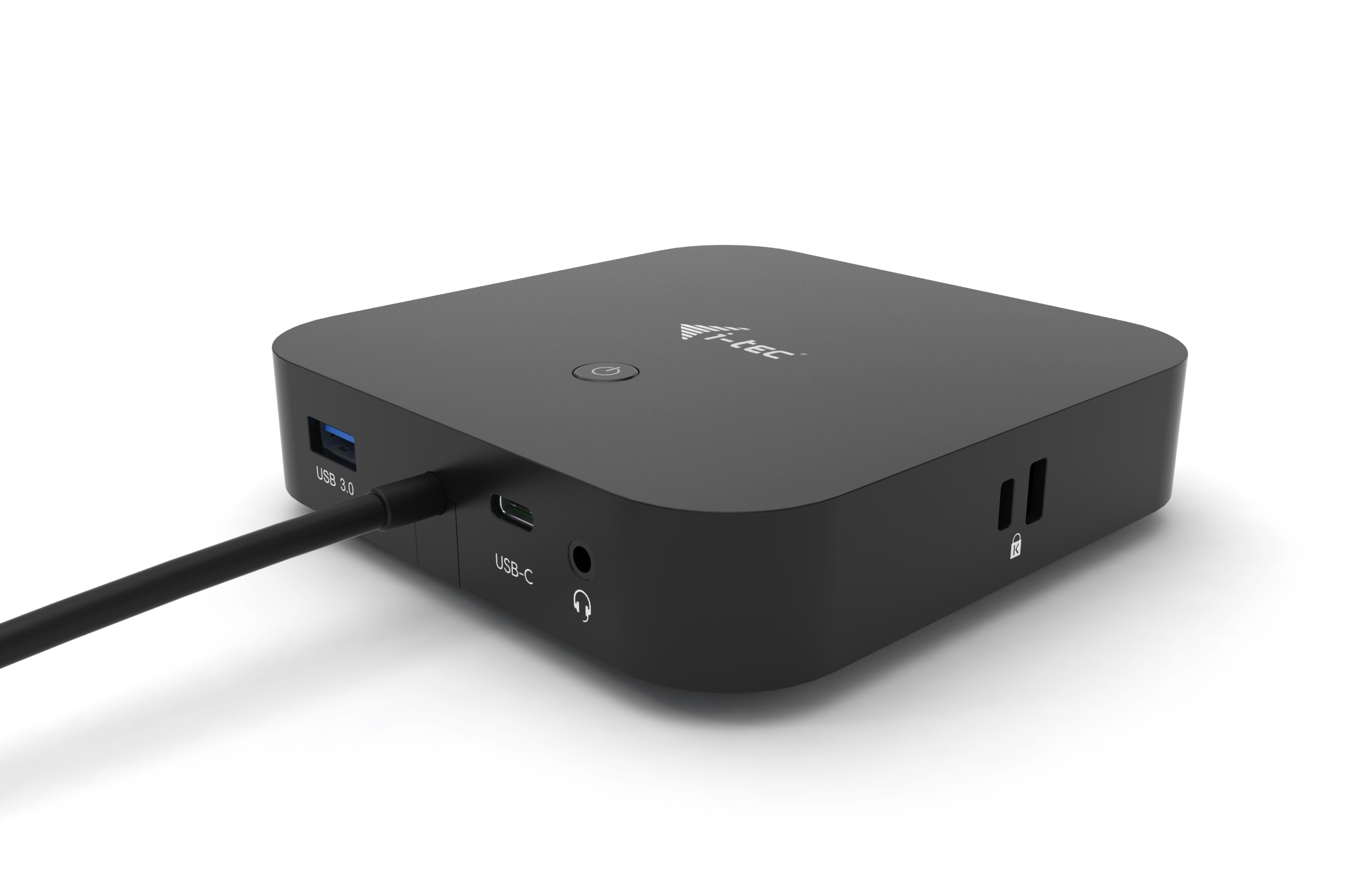 Een zwart, vierkant apparaat met poorten, waaronder USB en USB-C, op een wit oppervlak.