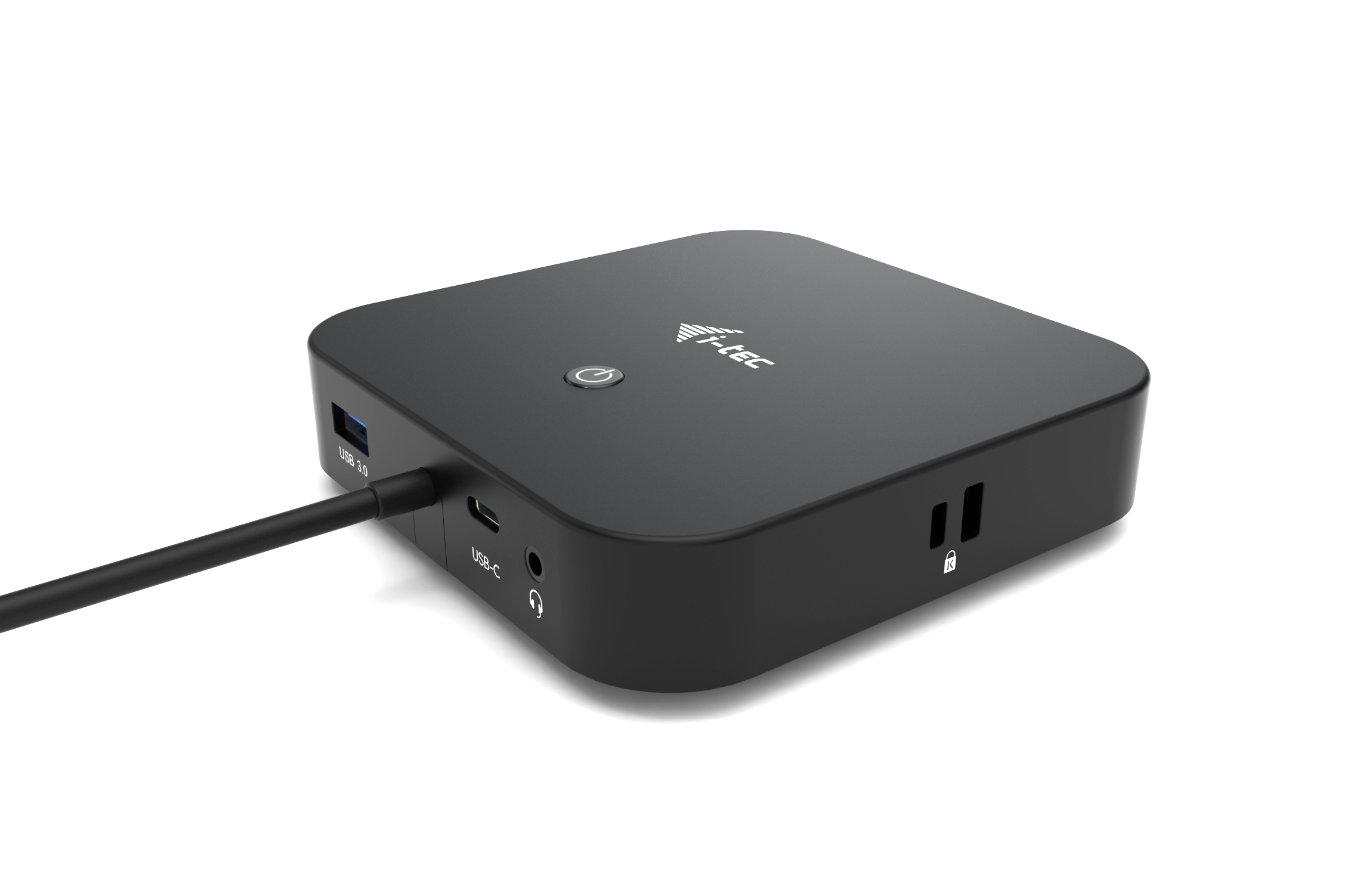 Black hub with USB, USB-C, power and other ports. Black background.