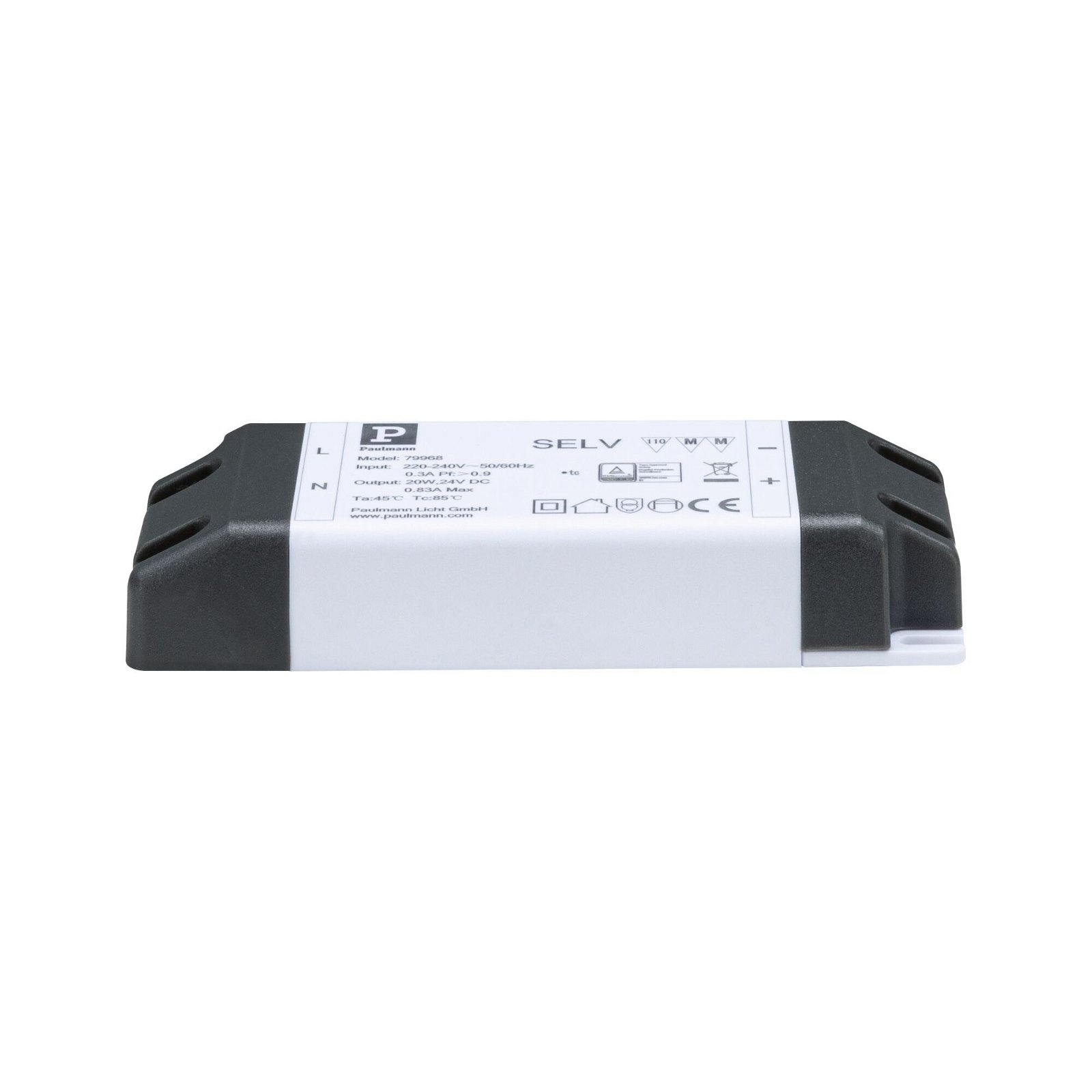 Czarny transformator elektryczny z białą etykietą i tekstem. Białe tło.