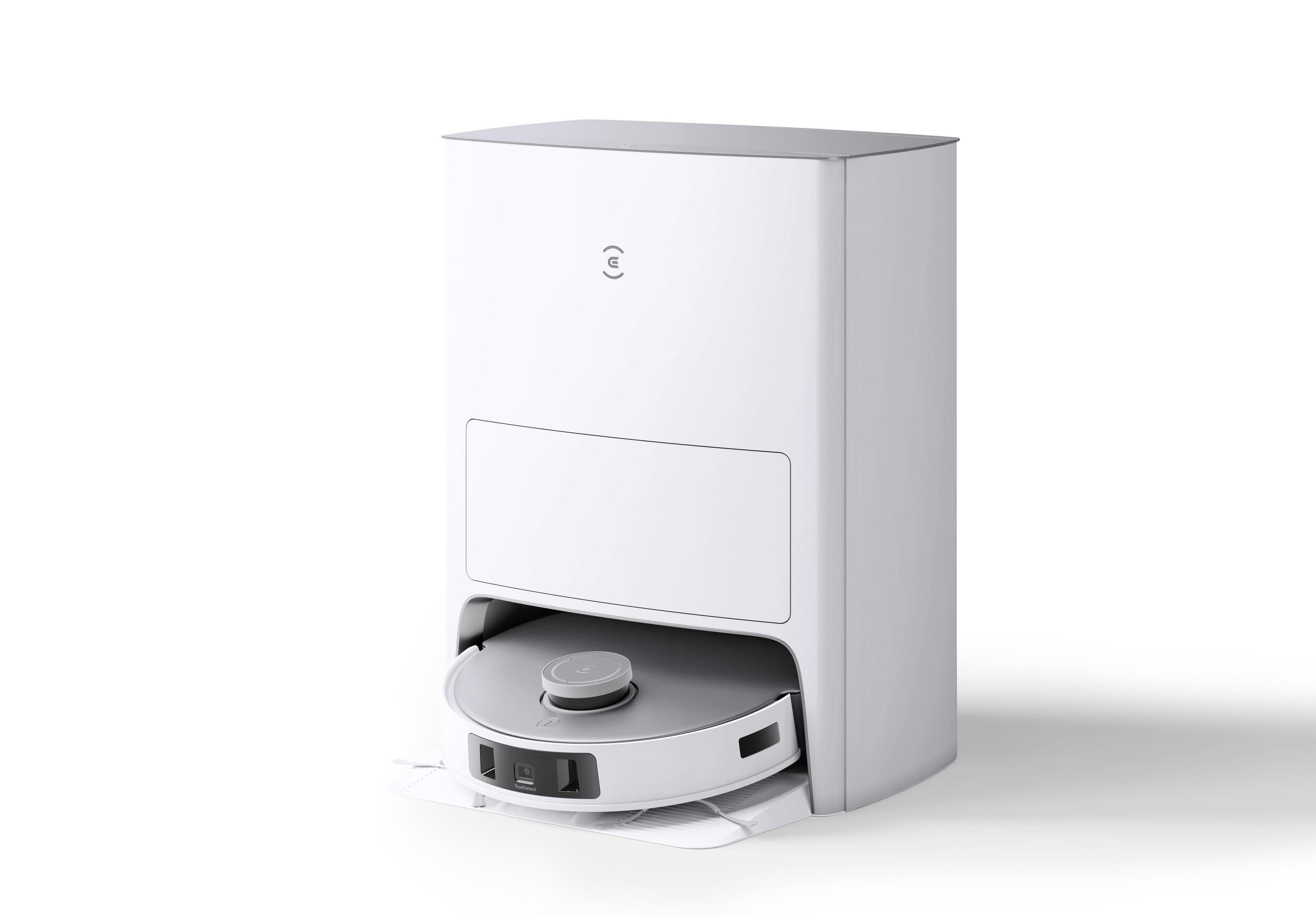 Biały odkurzacz automatyczny ze stacją ładującą. Ma okrągły kształt.