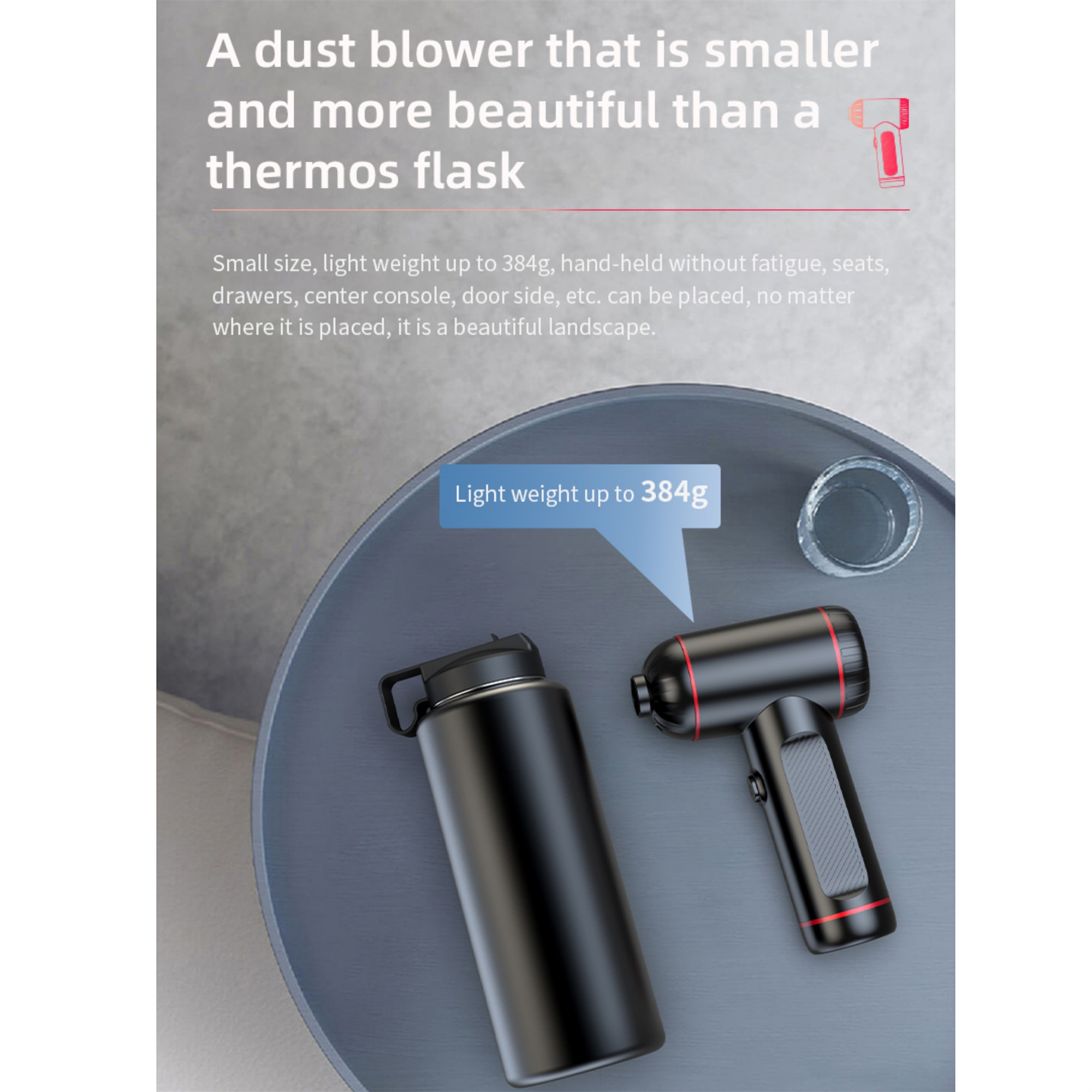 Ein schwarzer und roter Staubbläser und eine schwarze Thermoskanne stehen auf einem grauen Tisch mit Text.