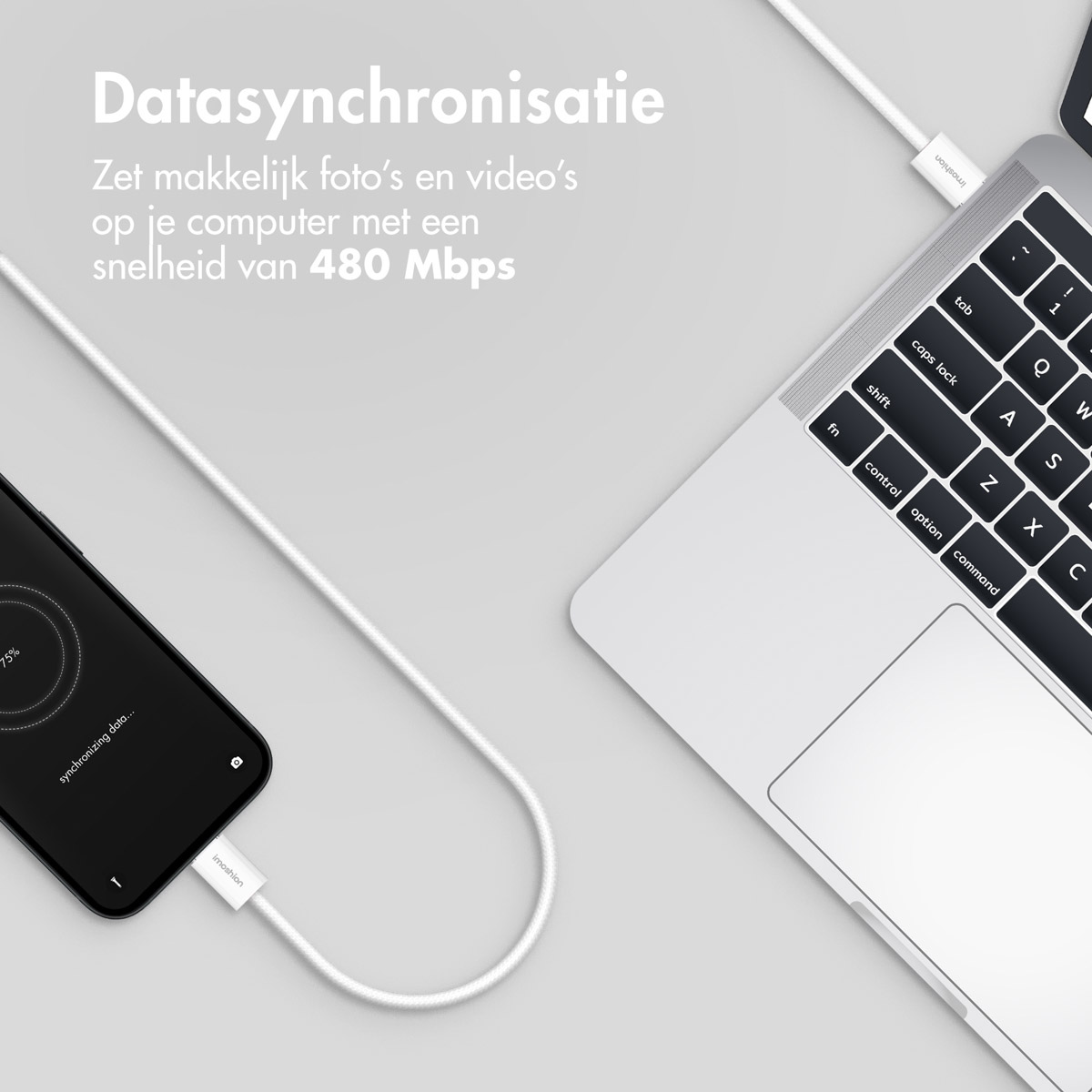 A smartphone is connected to a laptop for data synchronization at 480 Mbps.
