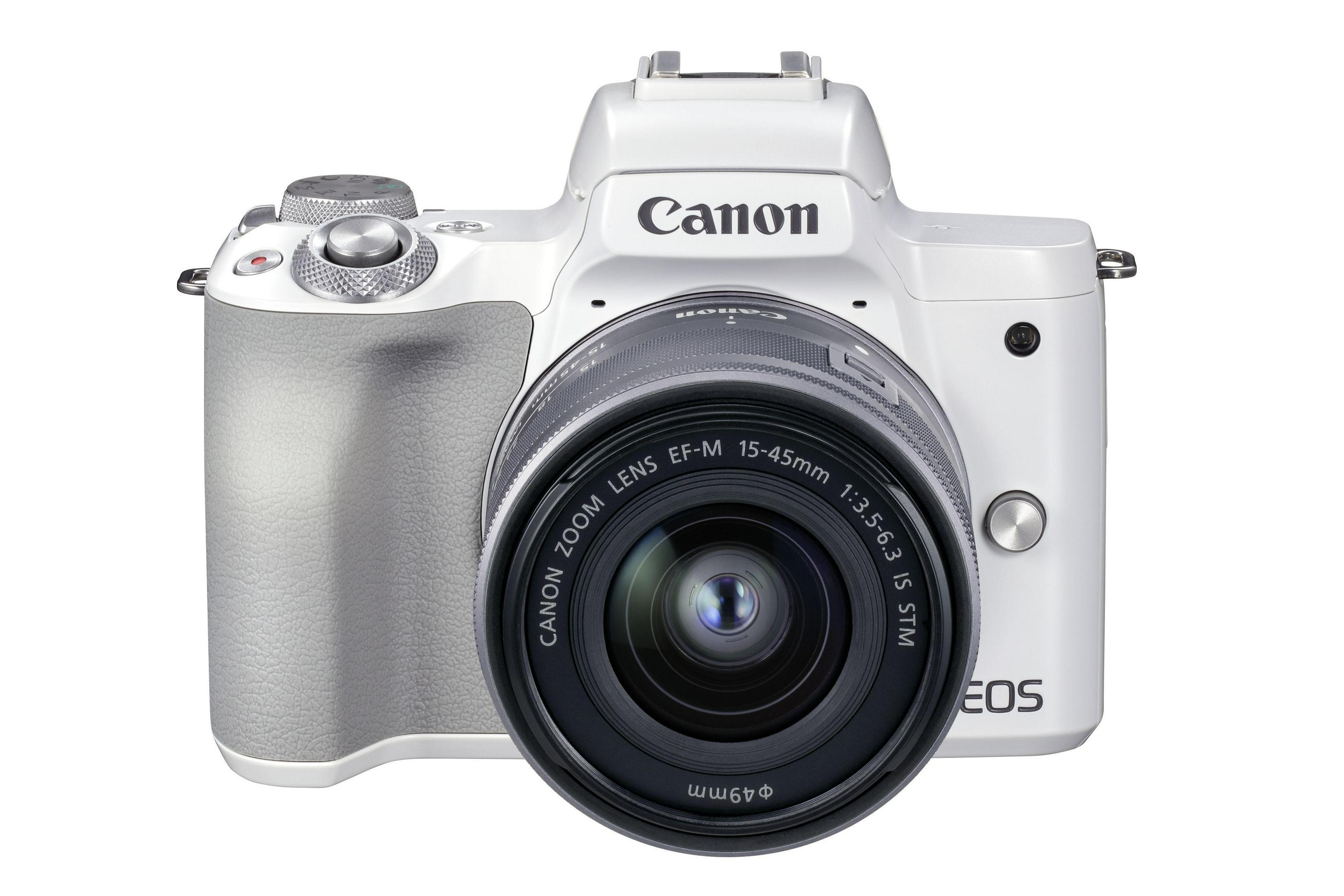 Fotocamera Canon bianca con obiettivo e la parola Canon in alto.
