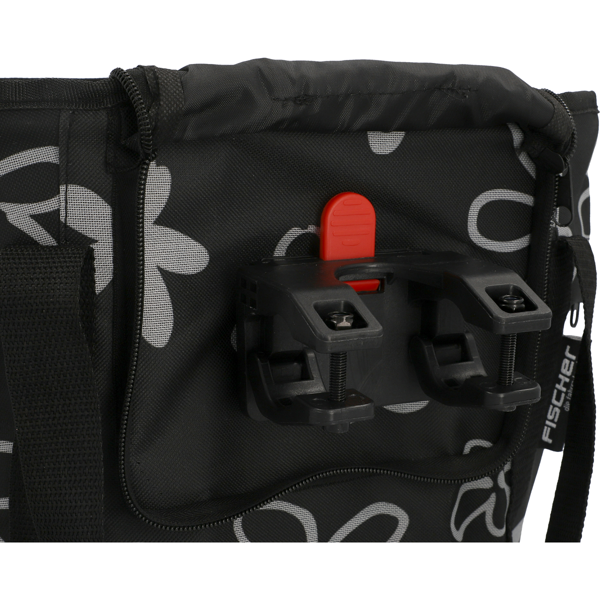 Eine schwarze Fahrradtasche mit Blumenmuster, an einer schwarzen Halterung befestigt.