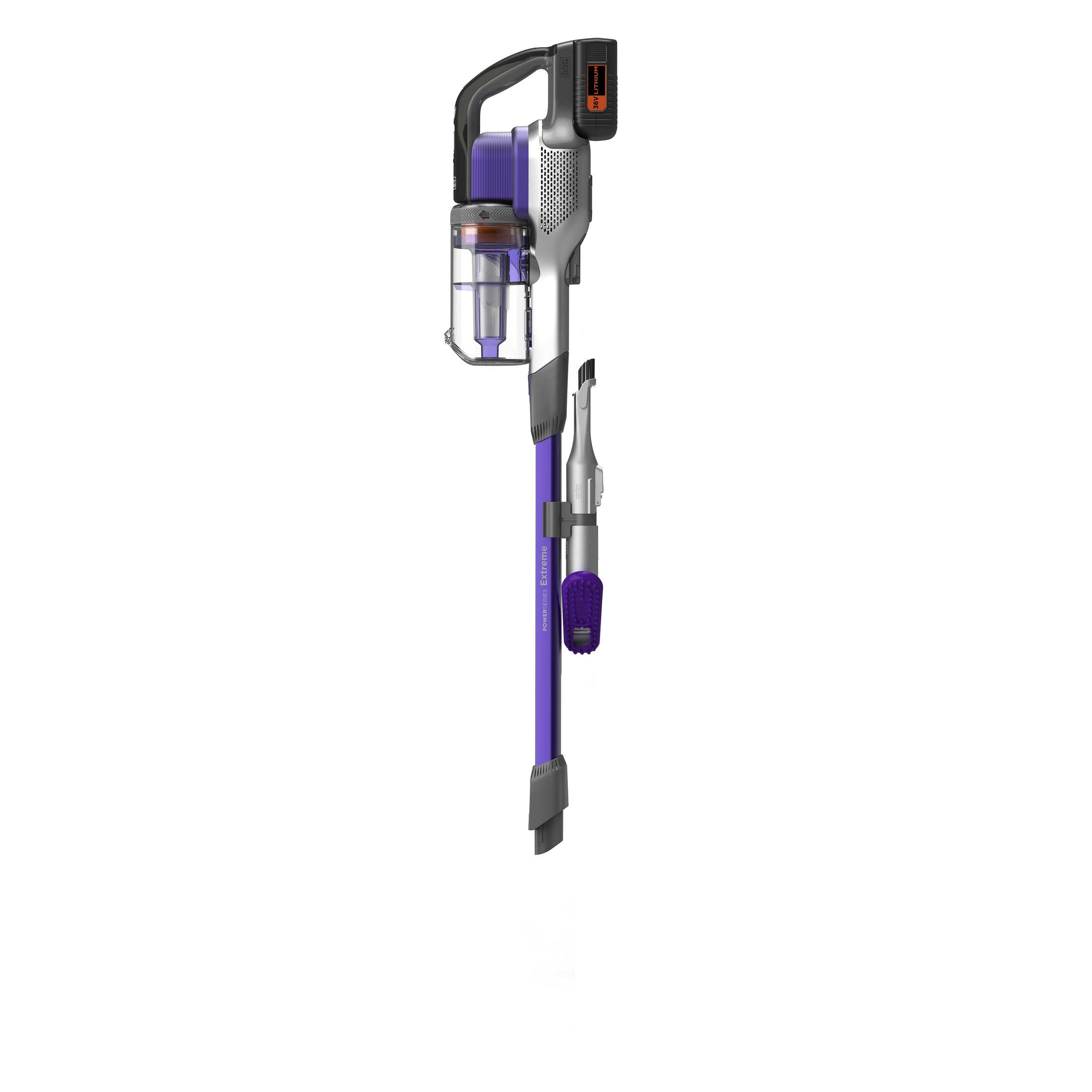 Purple and gray cordless vacuum cleaner. Detachable nozzle attachment. The unit is upright.