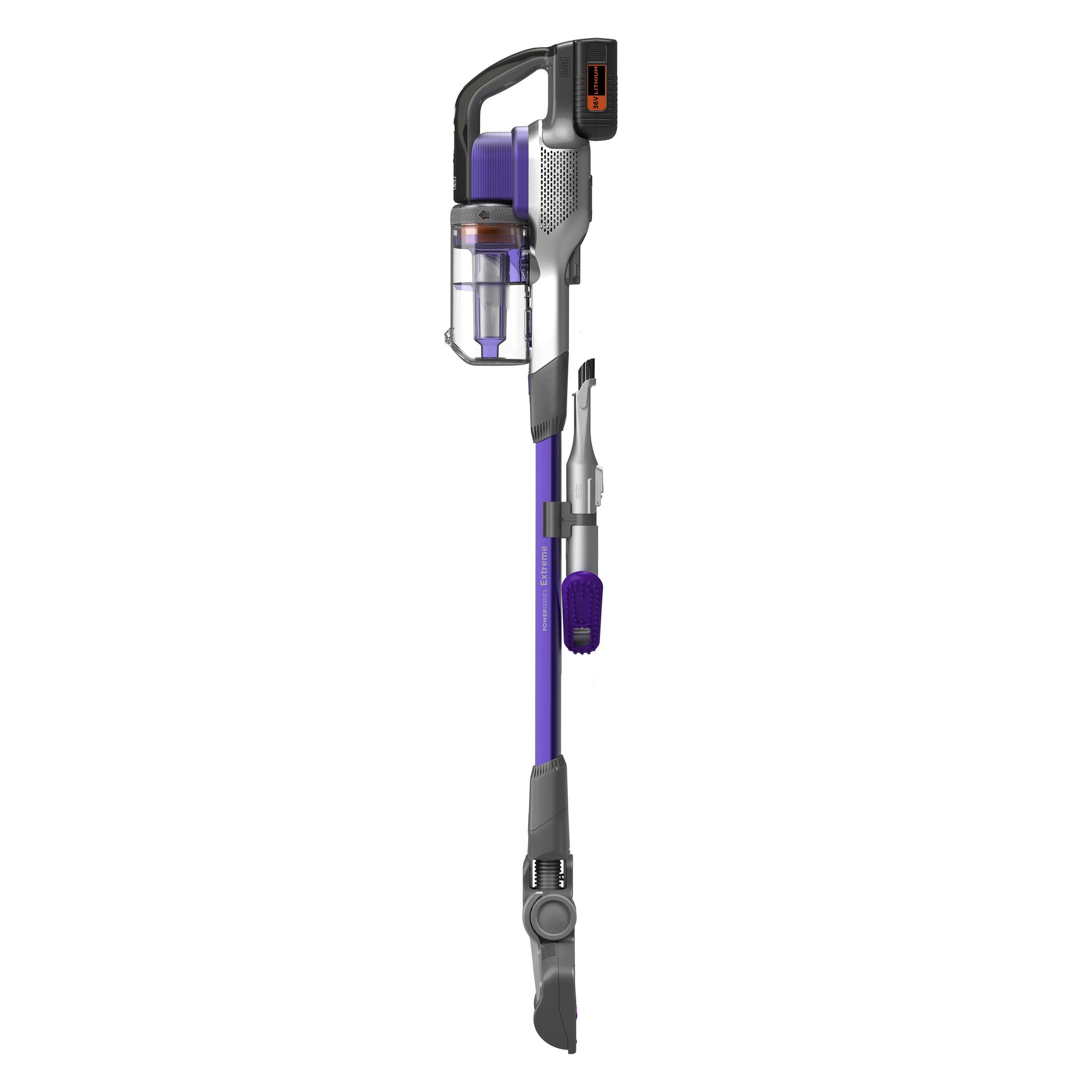 A purple and silver cordless vacuum cleaner. It is standing upright against a white background.
