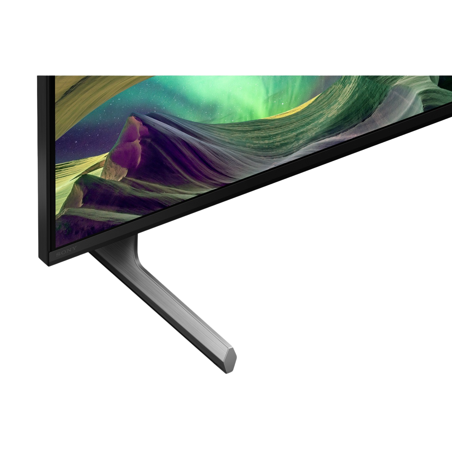 Una TV nera con supporto argentato, che mostra un paesaggio colorato.