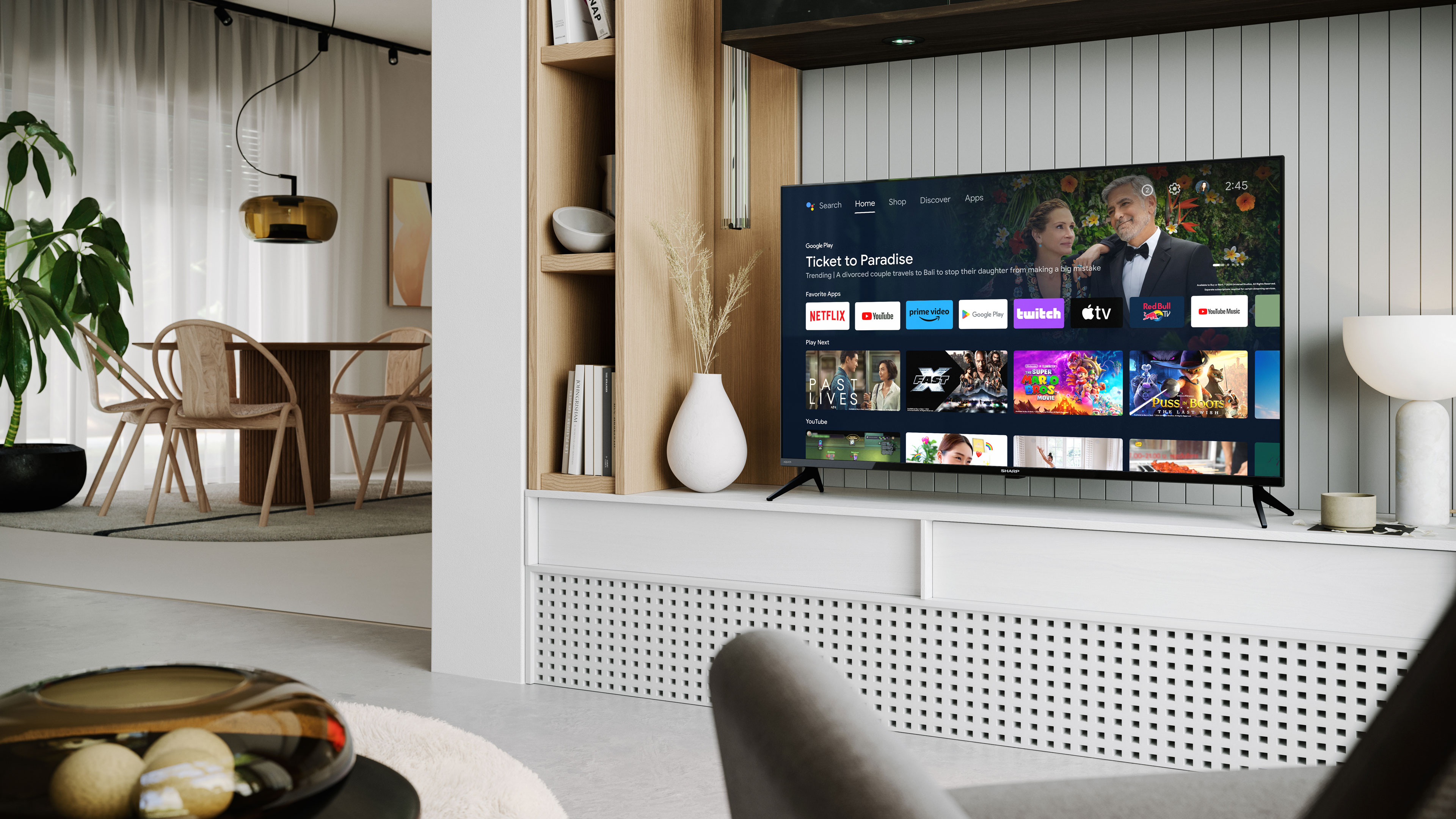 Salon z telewizorem, stołem z krzesłami i białą ścianą z drewnianymi akcentami.