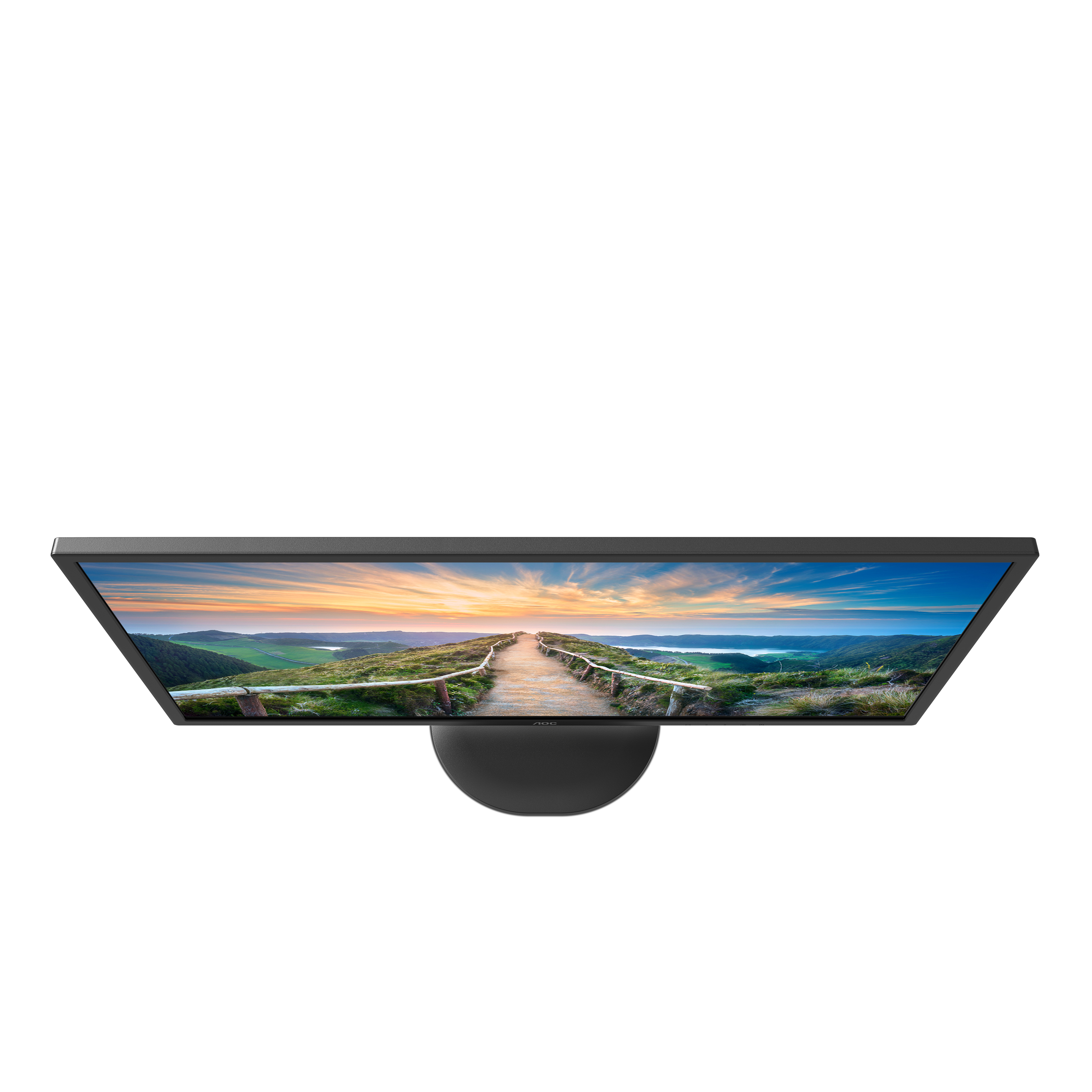 Monitor komputera, widok z góry, wyświetlający scenę zachodu słońca ze ścieżką i płotem.