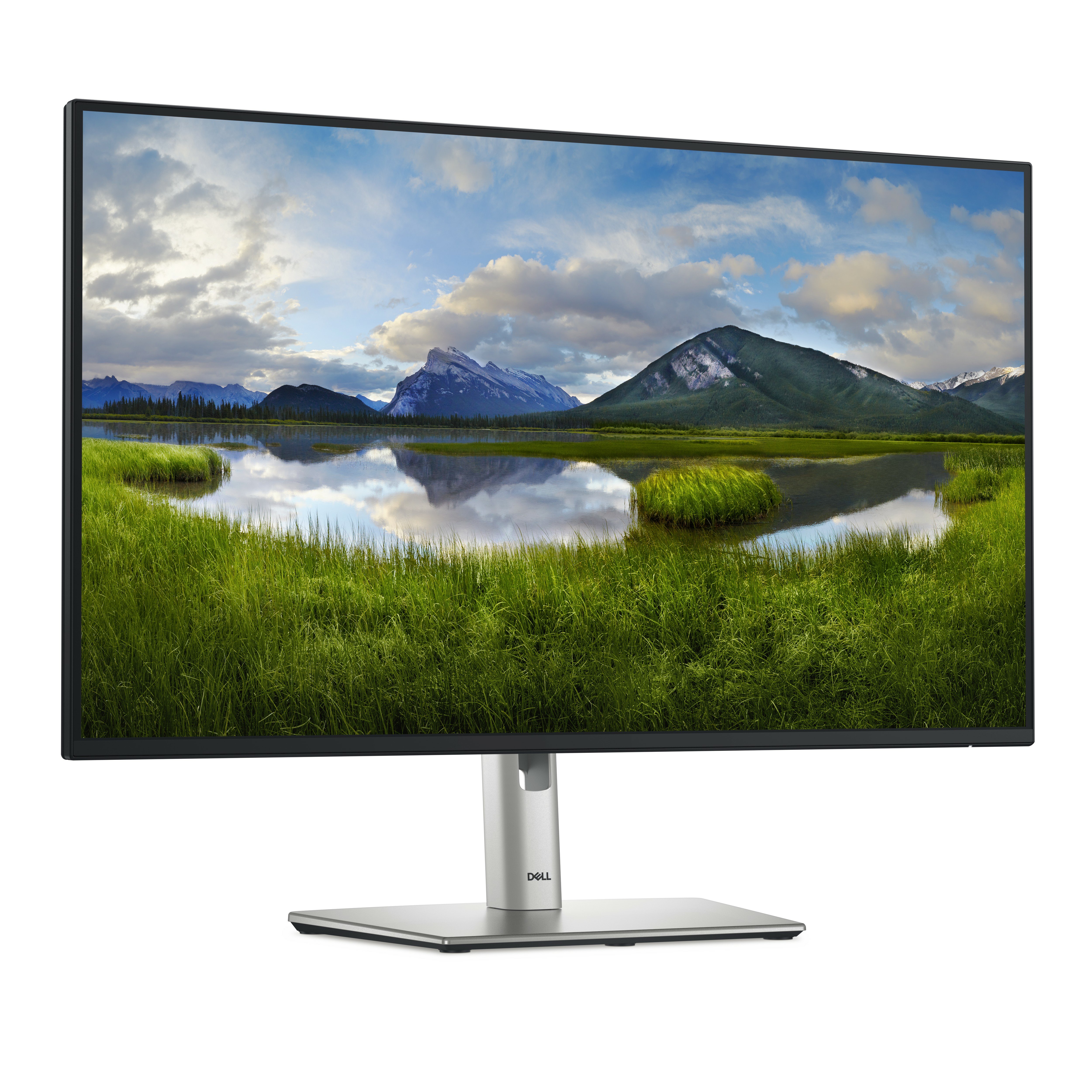 Un monitor de ordenador que muestra un paisaje escénico de montañas, agua y hierba verde.