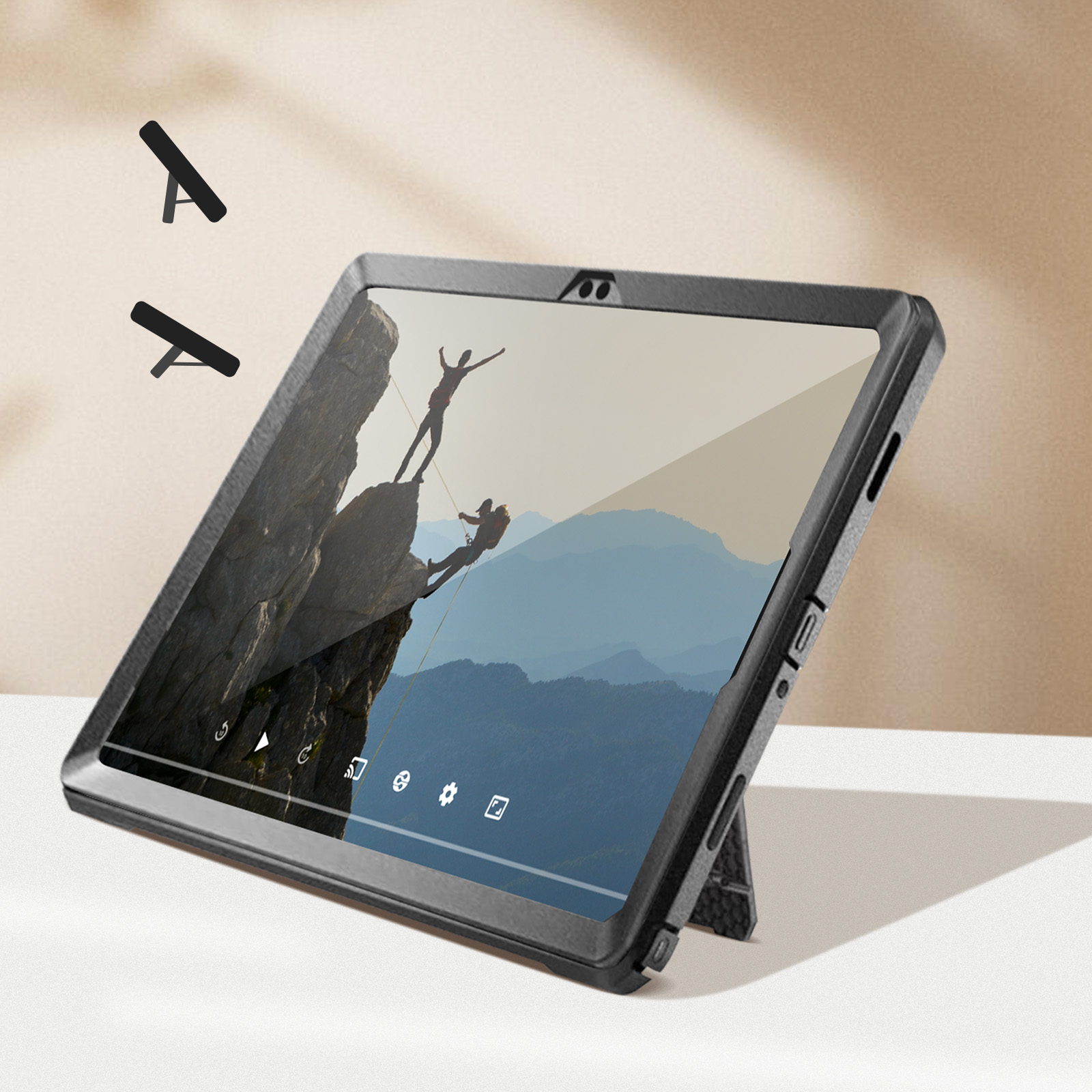Tablet mit Ständer, der ein Video von Kletterern auf einem Berg zeigt.