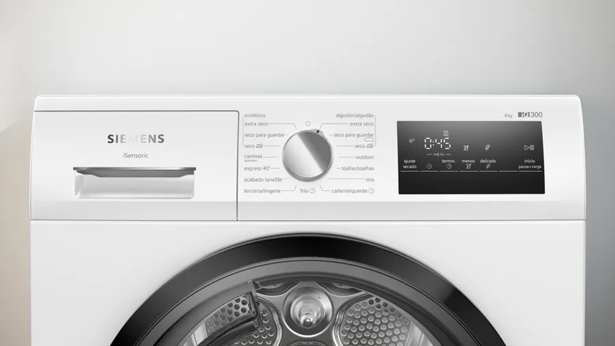 Primer plano del panel de control de una lavadora Siemens blanca con varias configuraciones y una pantalla.