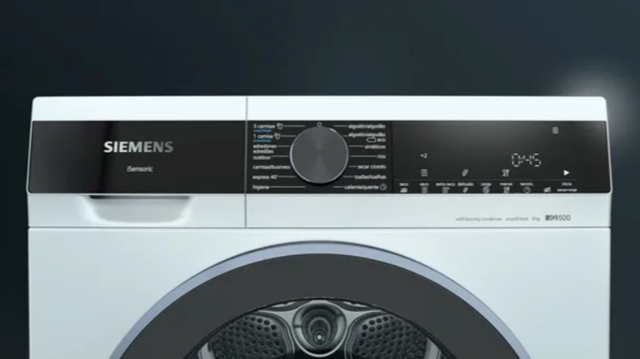 Primer plano del panel de control de una lavadora Siemens blanca. Tiene un panel negro.