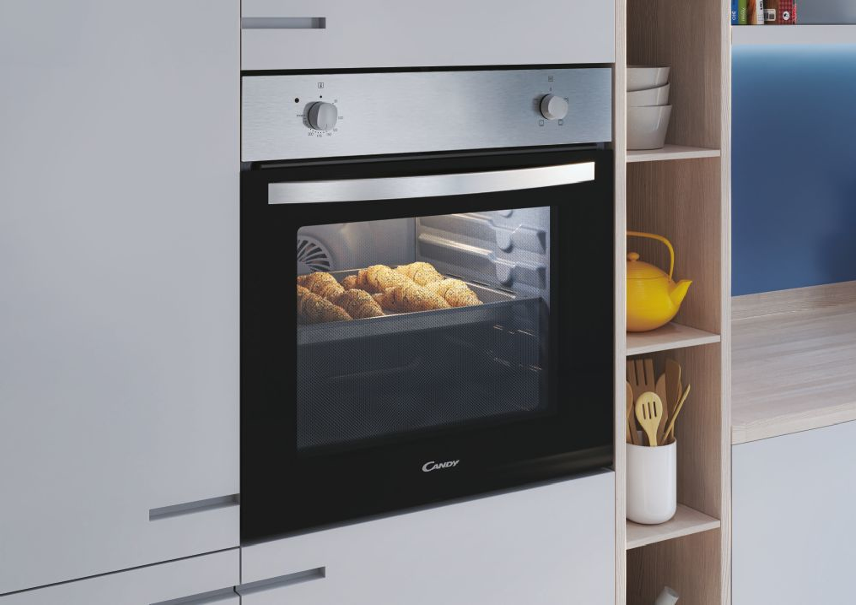 Un forno integrato in un mobile. La porta del forno è aperta, mostrando croissant che cuociono all'interno.
