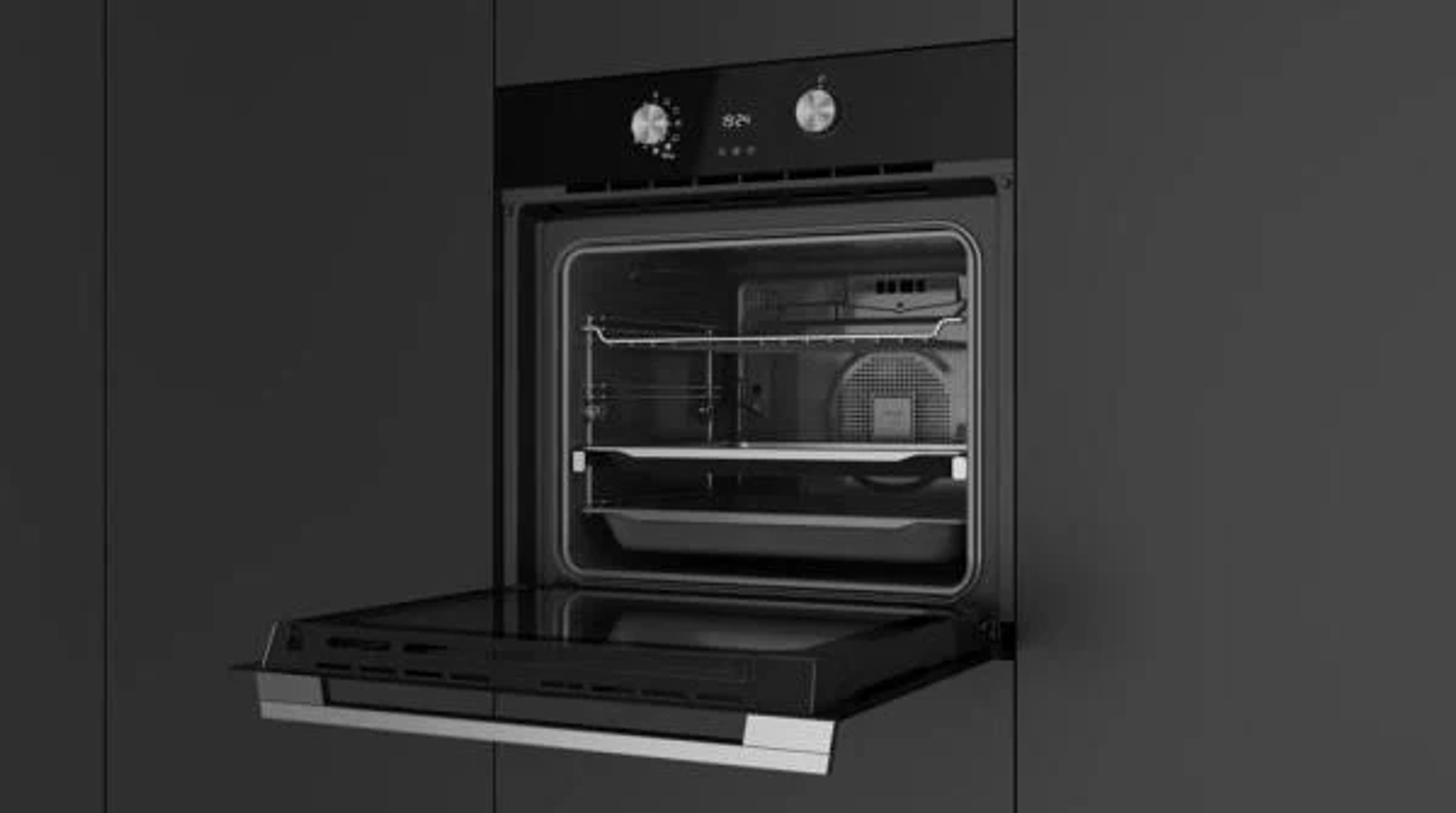 Imagen en blanco y negro de un horno con la puerta abierta.