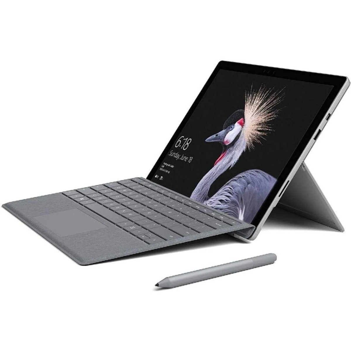 Ordinateur portable Surface avec clavier et stylet. L'écran affiche une image de grue.