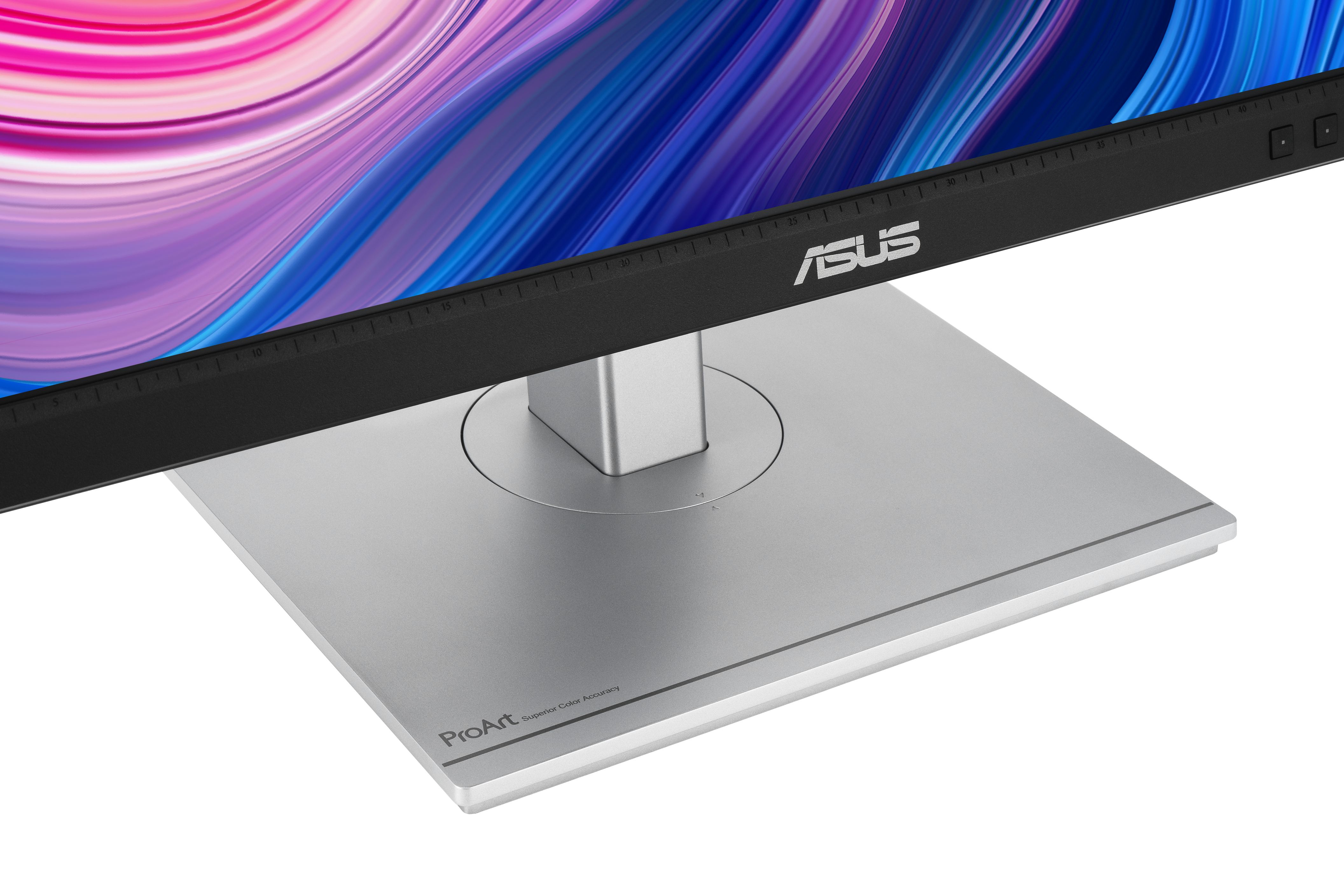 Srebrna podstawa monitora z logo ASUS na czarnej górze. Ekran pokazuje kolorowe tło.