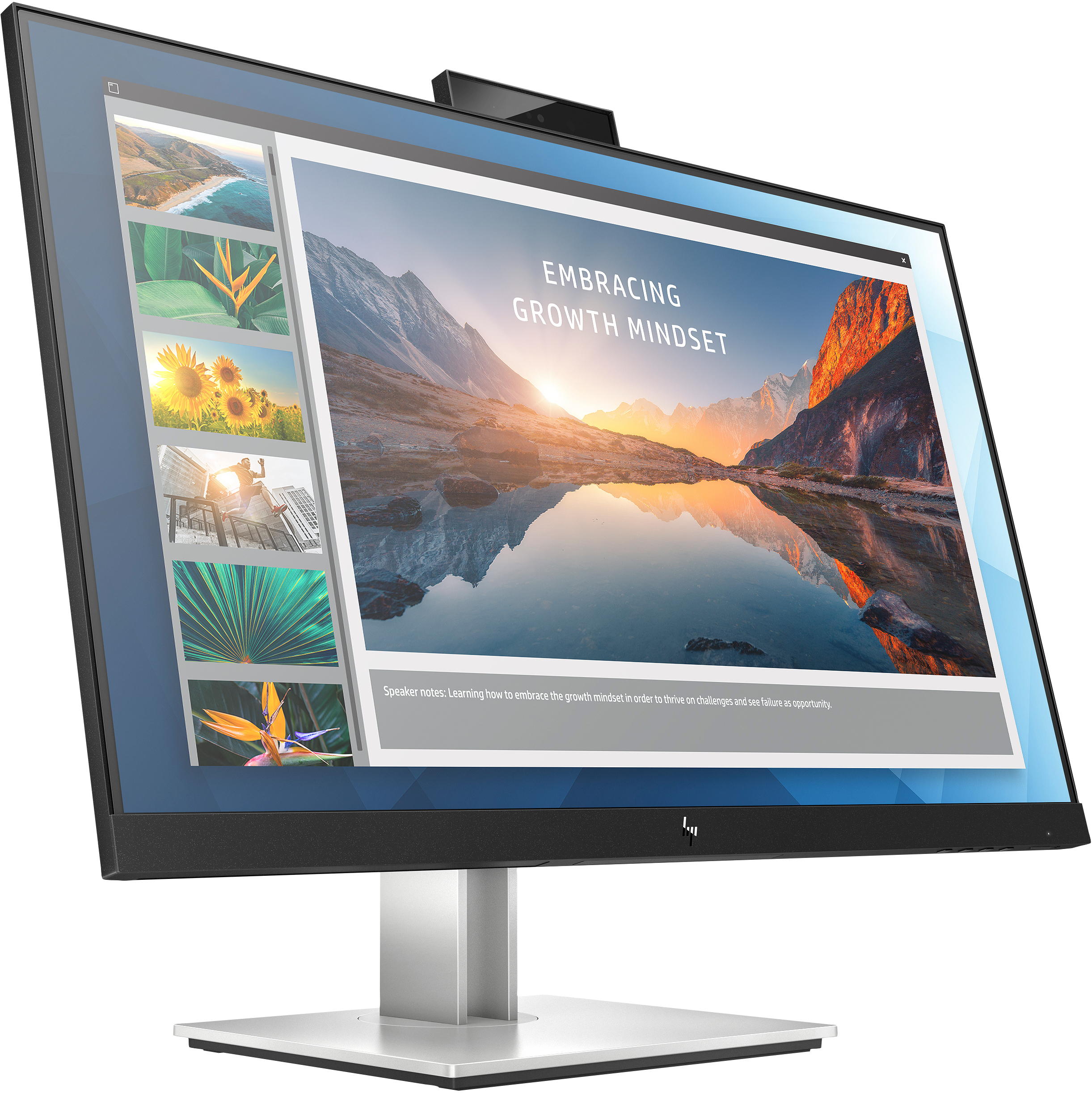 Monitor che mostra una presentazione su una scrivania. Lo schermo mostra un paesaggio e del testo.