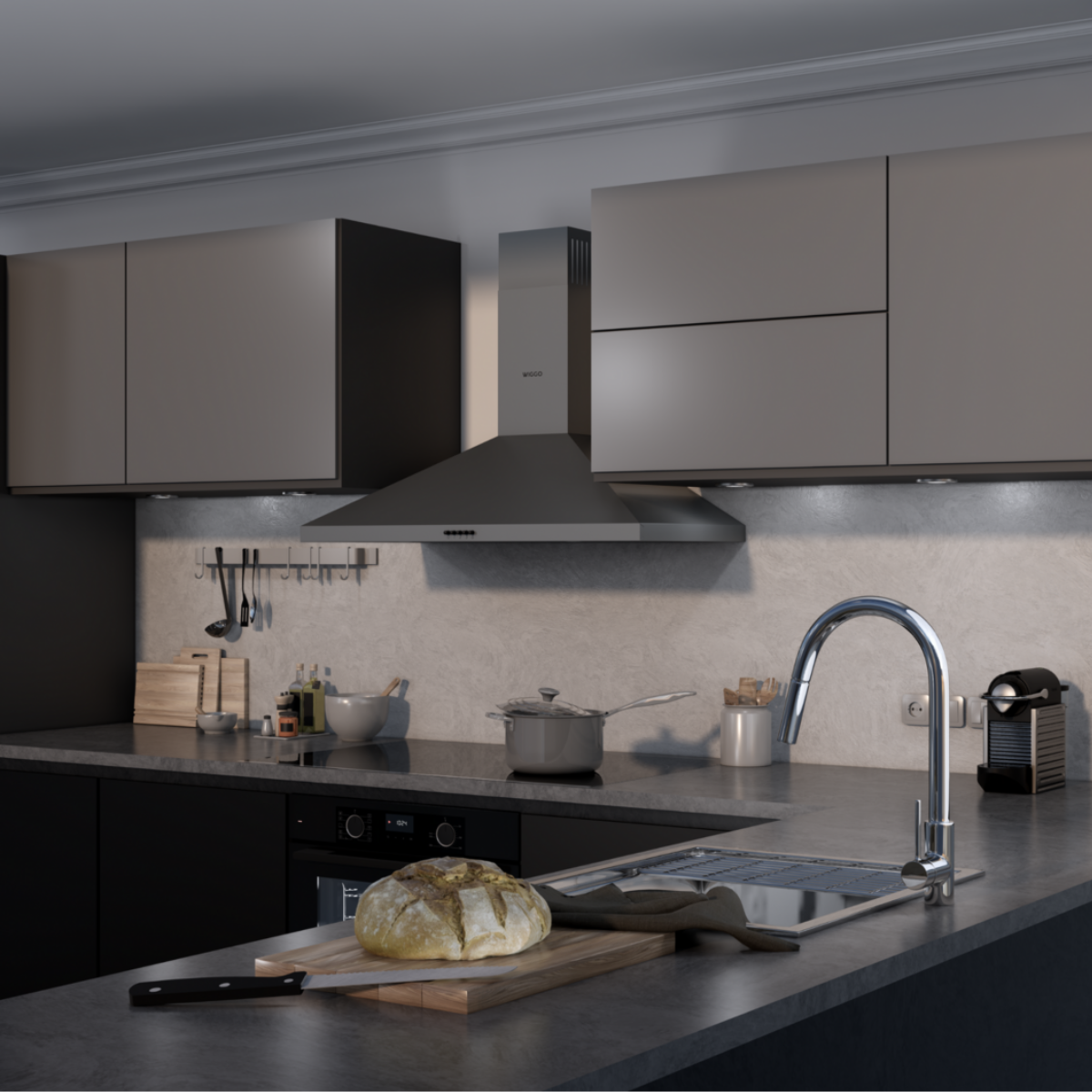 Intérieur de cuisine avec placards, hotte, évier, pain et appareils.