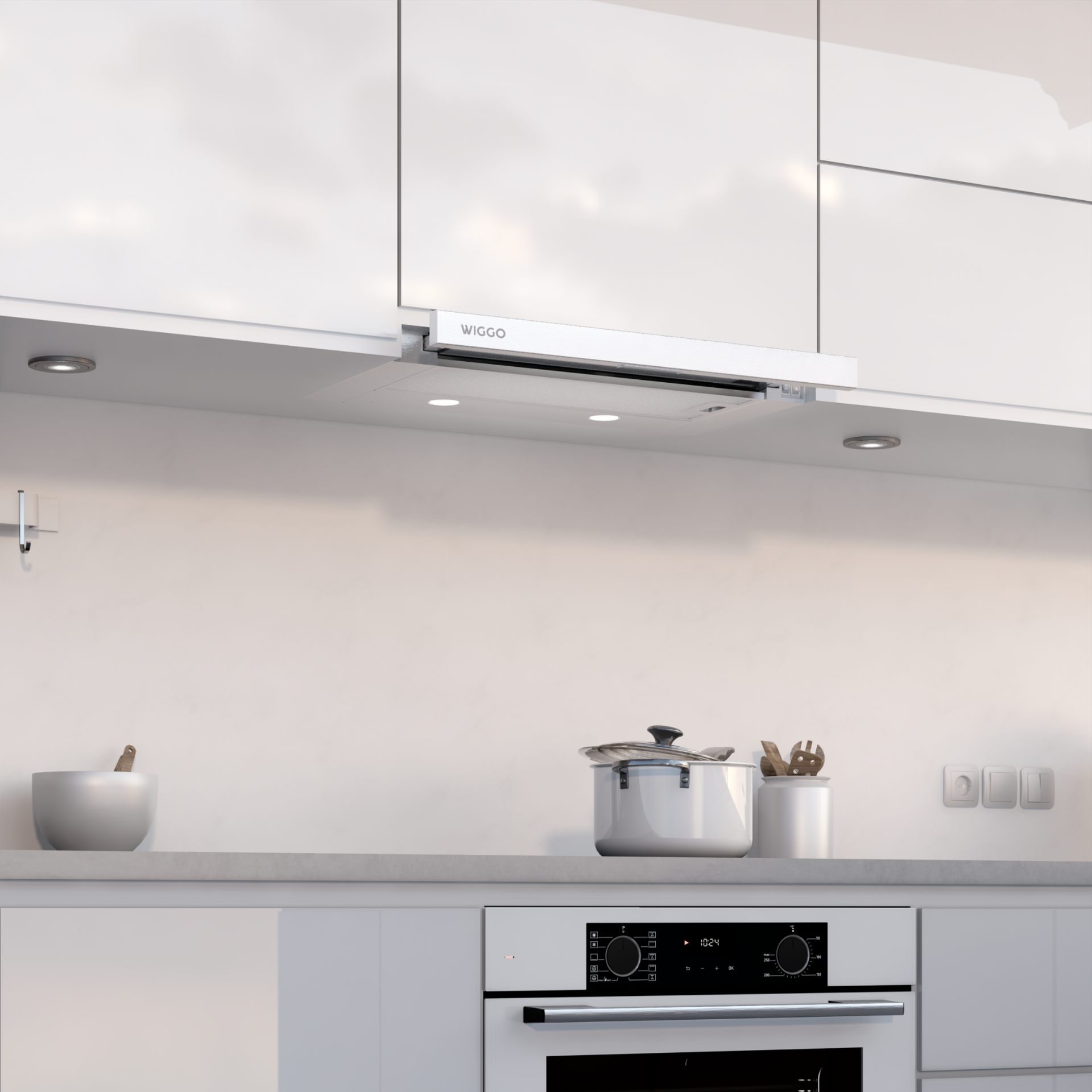 Hotte blanche dans une cuisine moderne avec des lumières.