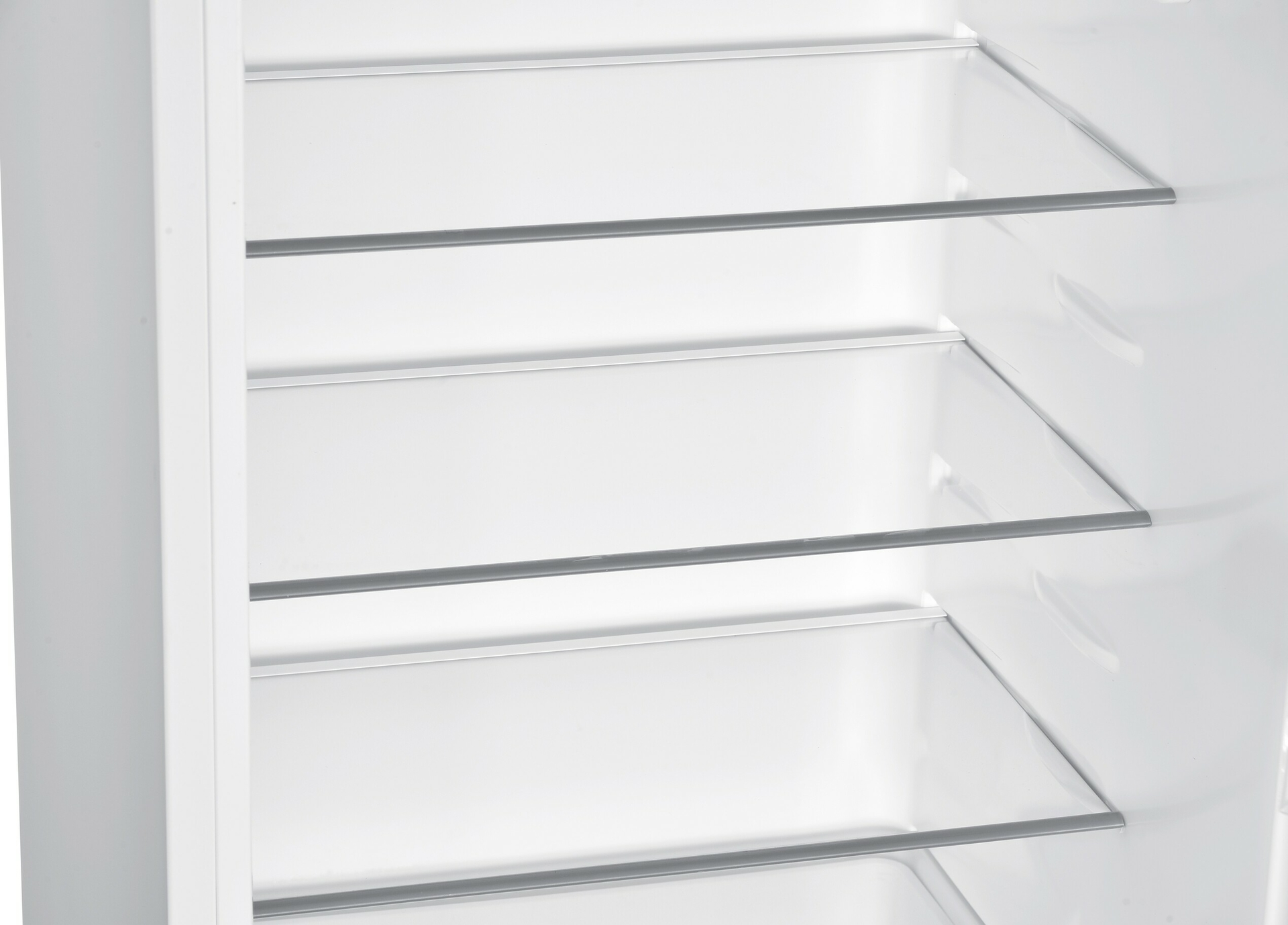 White fridge interior with glass shelves.