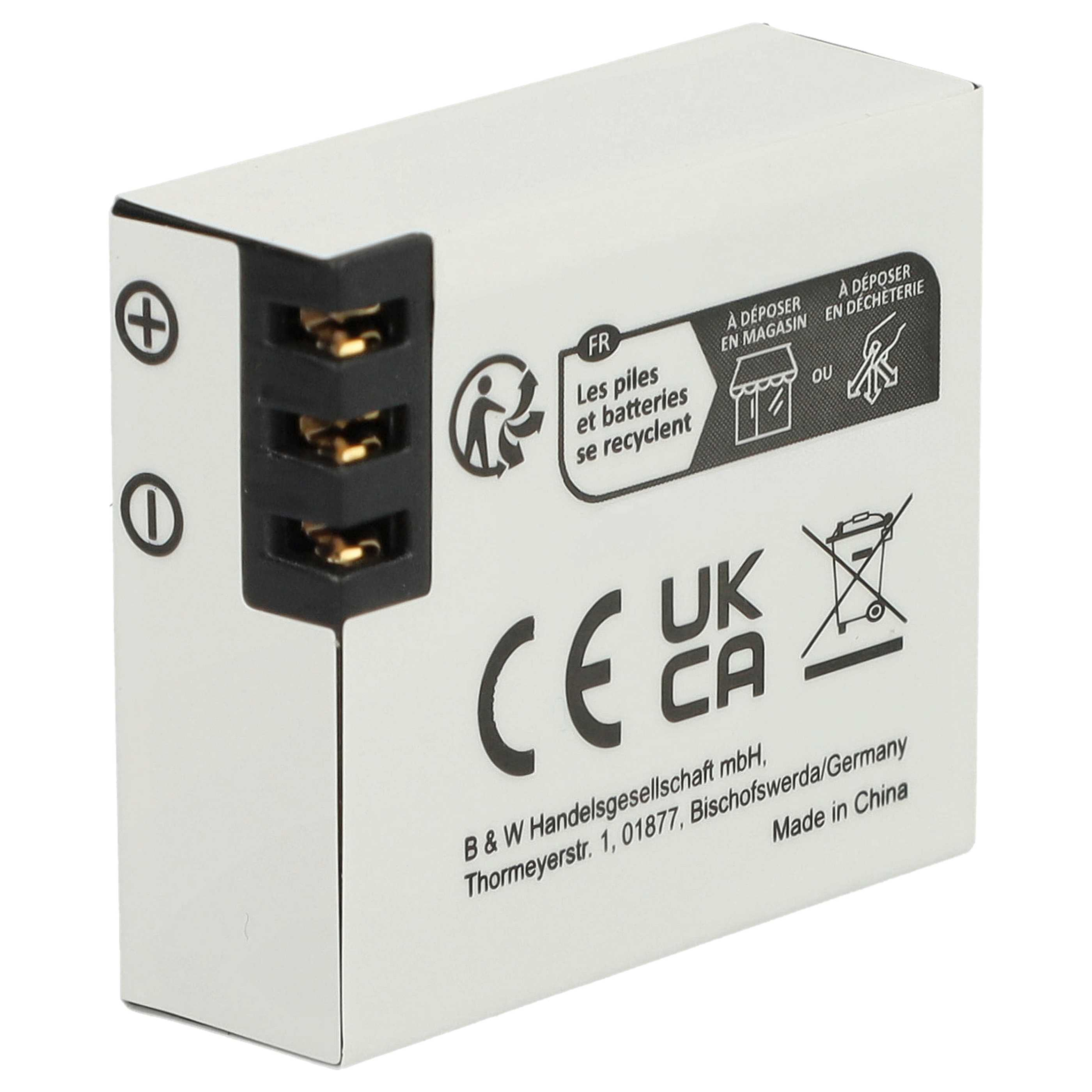 Ein weißes, rechteckiges Batteriepack mit schwarzen Anschlüssen und Text, UKCA- und CE-Zeichen.