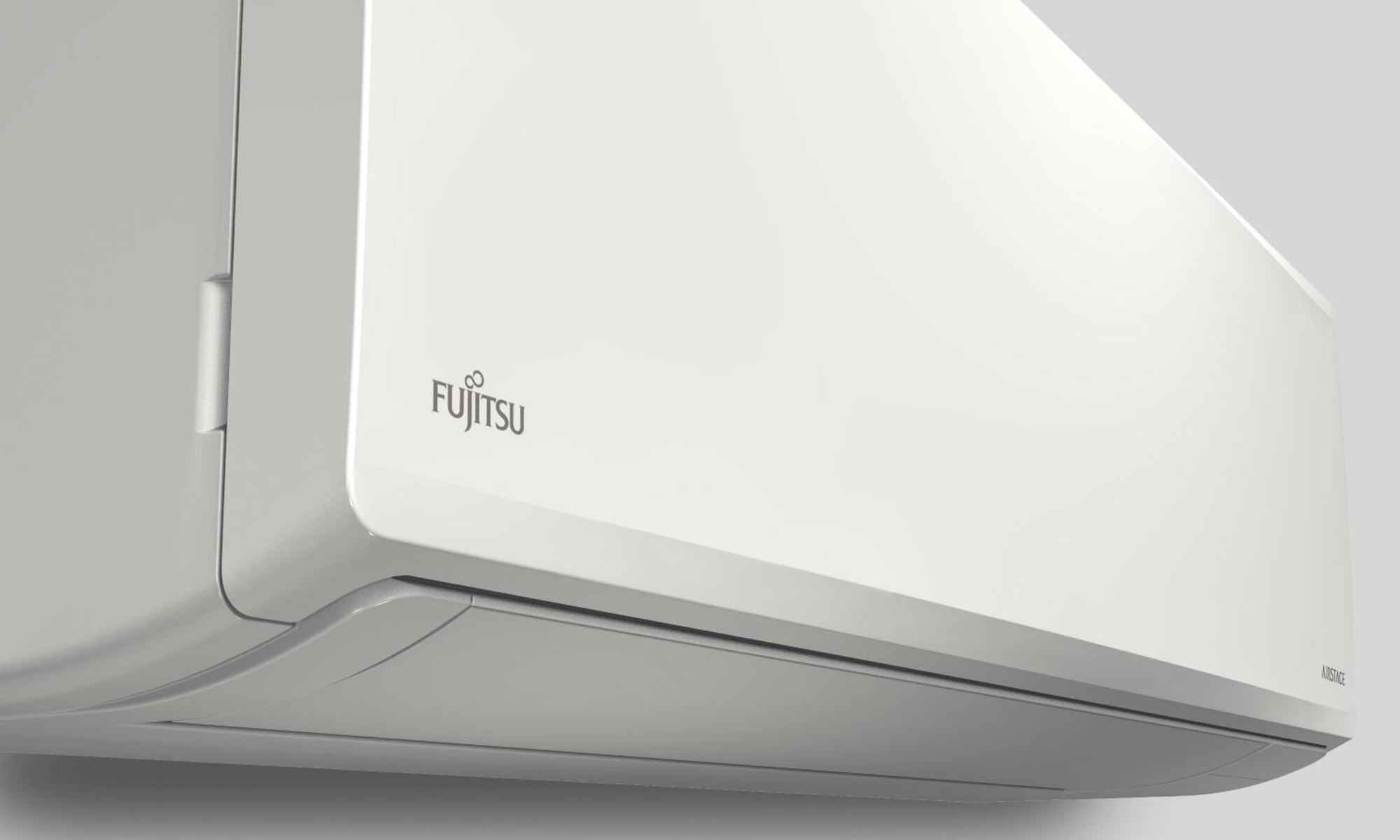 Unità condizionatore Fujitsu bianca con logo del marchio su sfondo grigio.