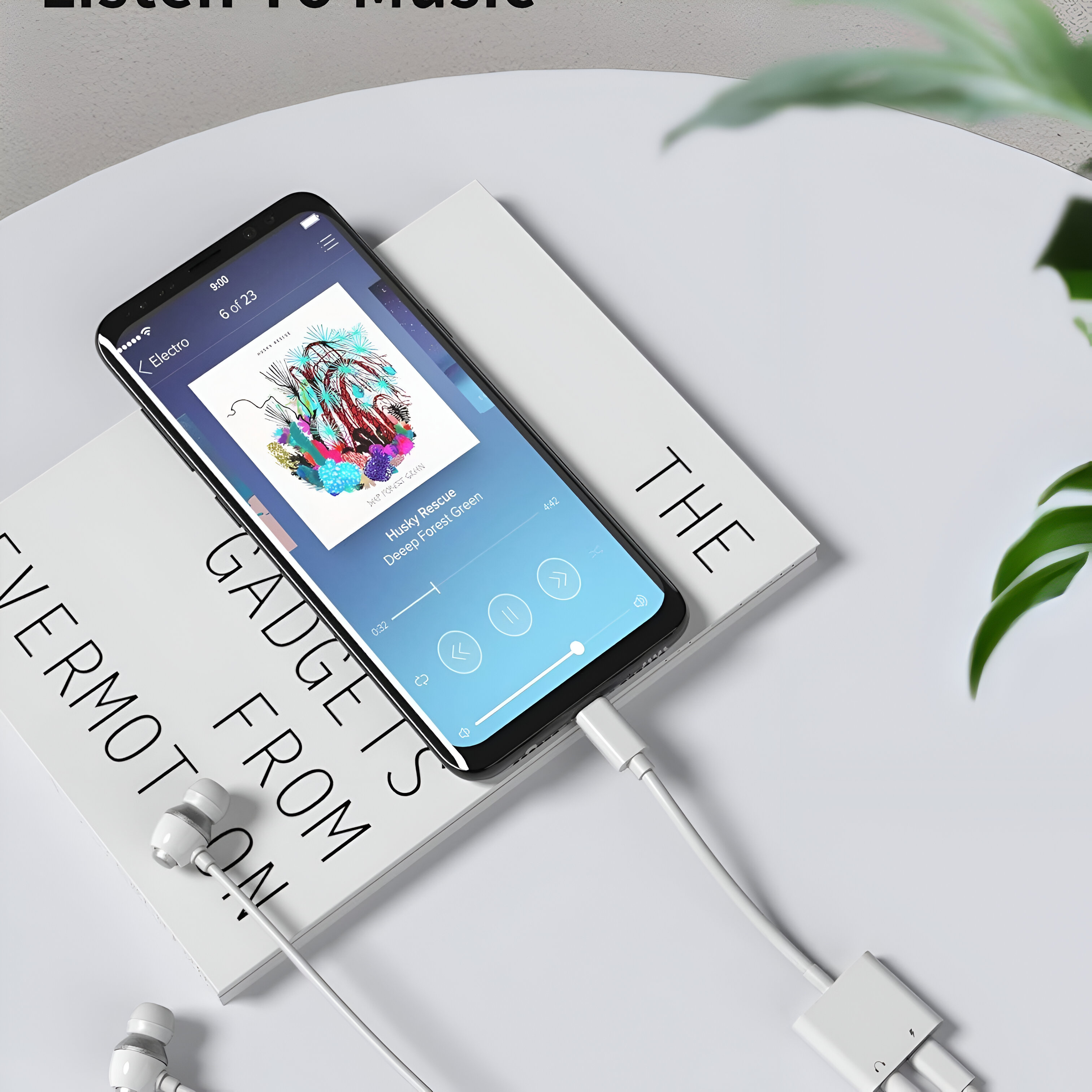 Smartphone mostrando interfaz de reproductor de música, con auriculares y cable.