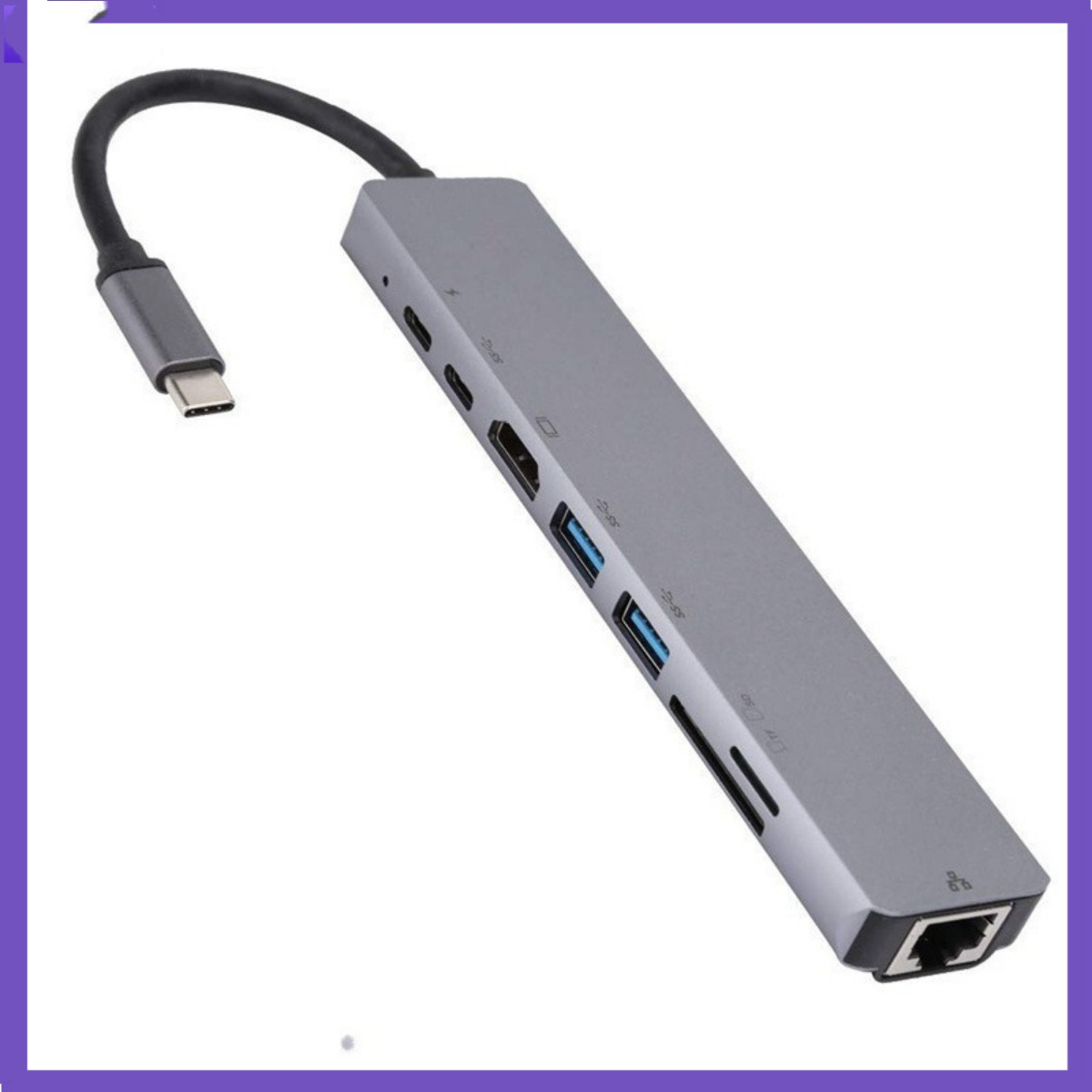 Ein grauer USB-C-Hub mit mehreren Anschlüssen: USB, HDMI und ein Kartenleser. Ein USB-C-Kabel ist angeschlossen.