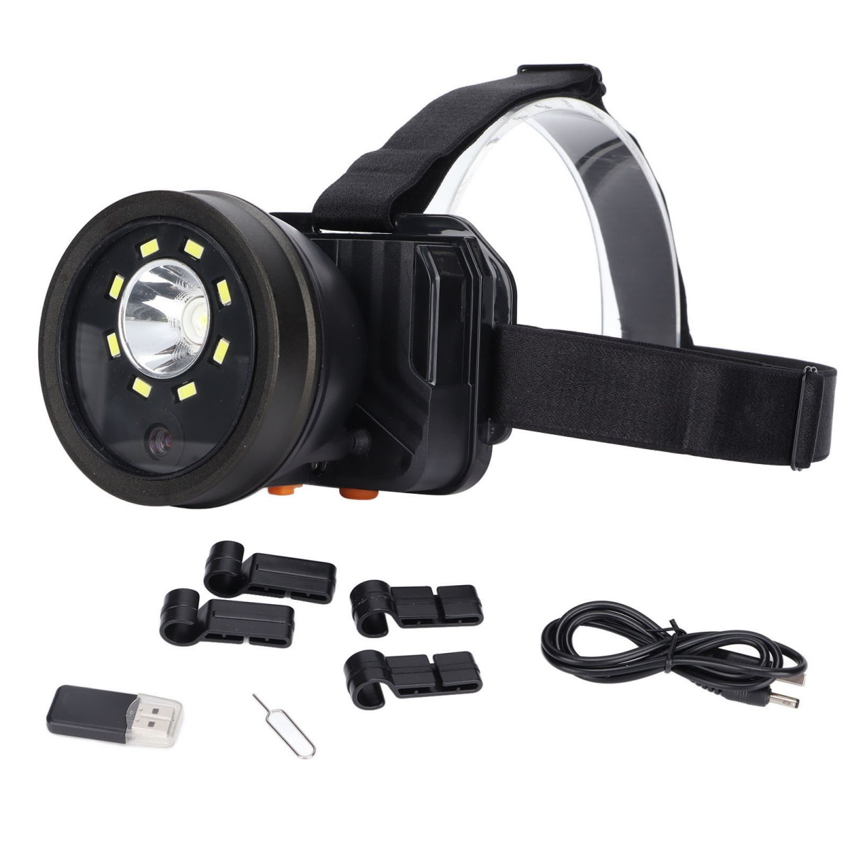 Schwarze Stirnlampe mit mehreren Zubehörteilen. Stirnlampe hat ein kreisförmiges Licht.