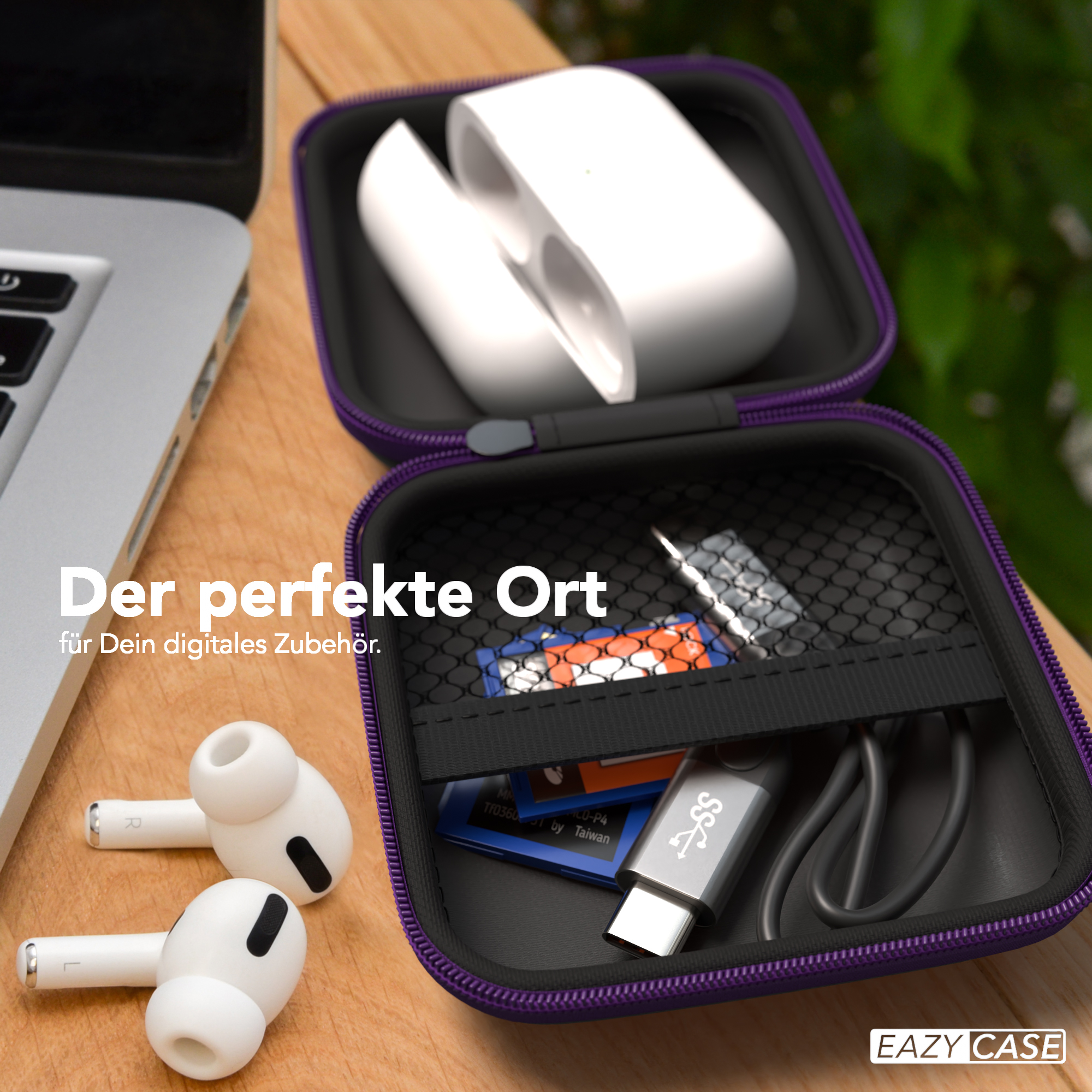 Eine geöffnete Hülle mit Zubehör und AirPods und einem Laptop in der Nähe.