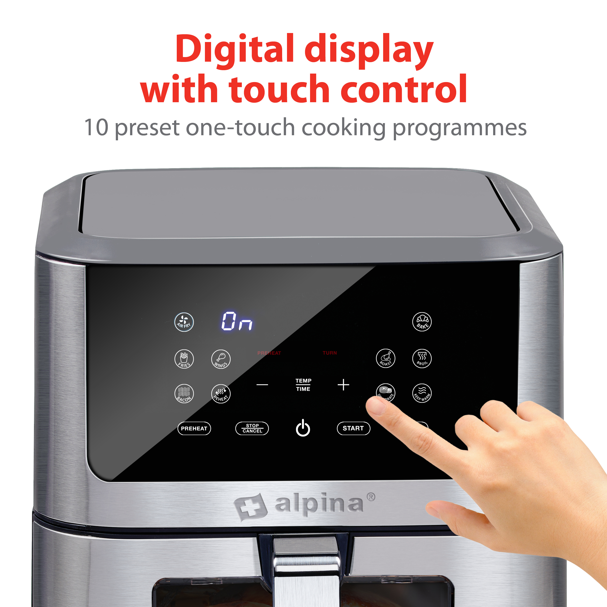 A stainless steel air fryer with a digital touch control panel. A hand is touching the panel.