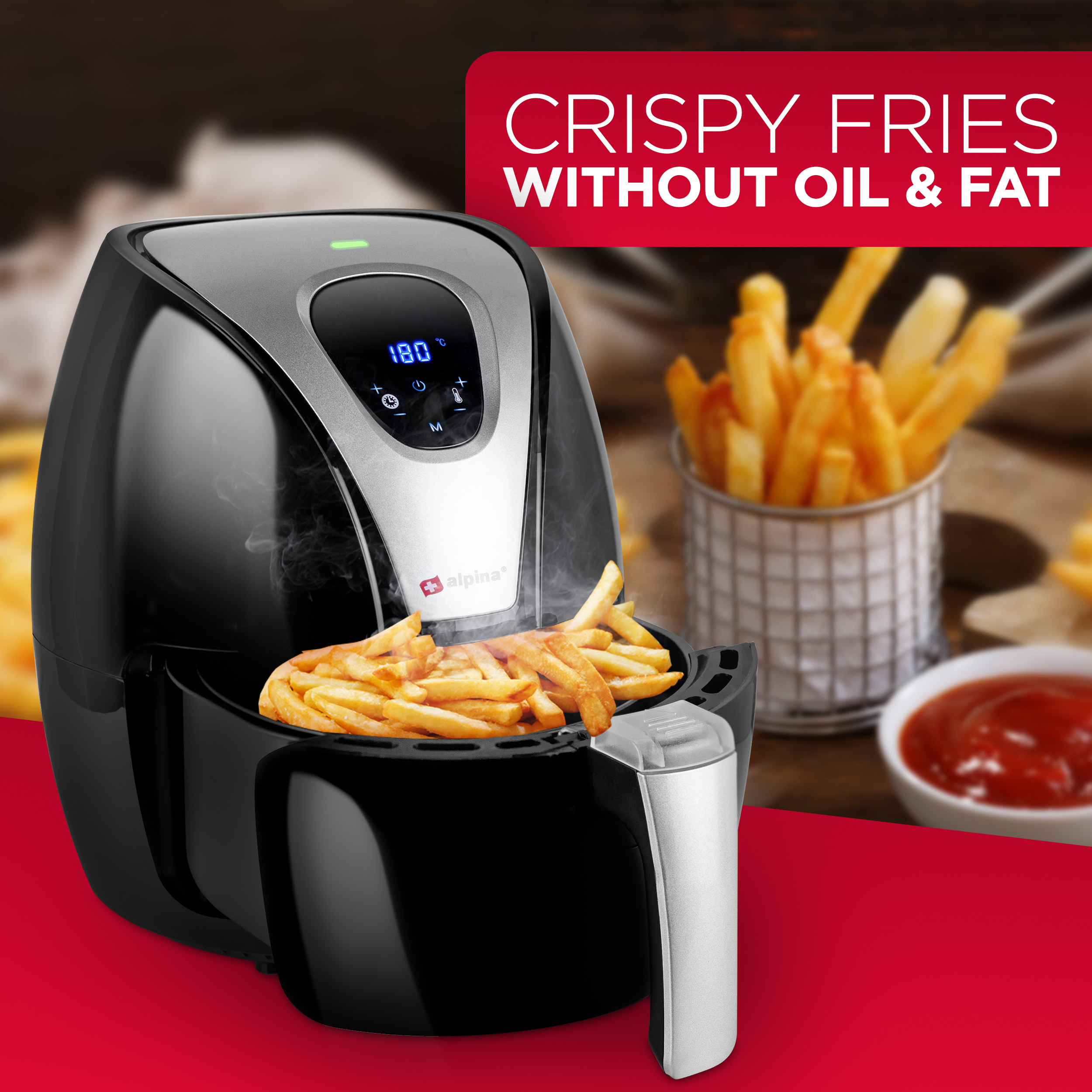 A black air fryer with fries, with text 'CRISPY FRIES WITHOUT OIL & FAT'. Ketchup in a bowl.