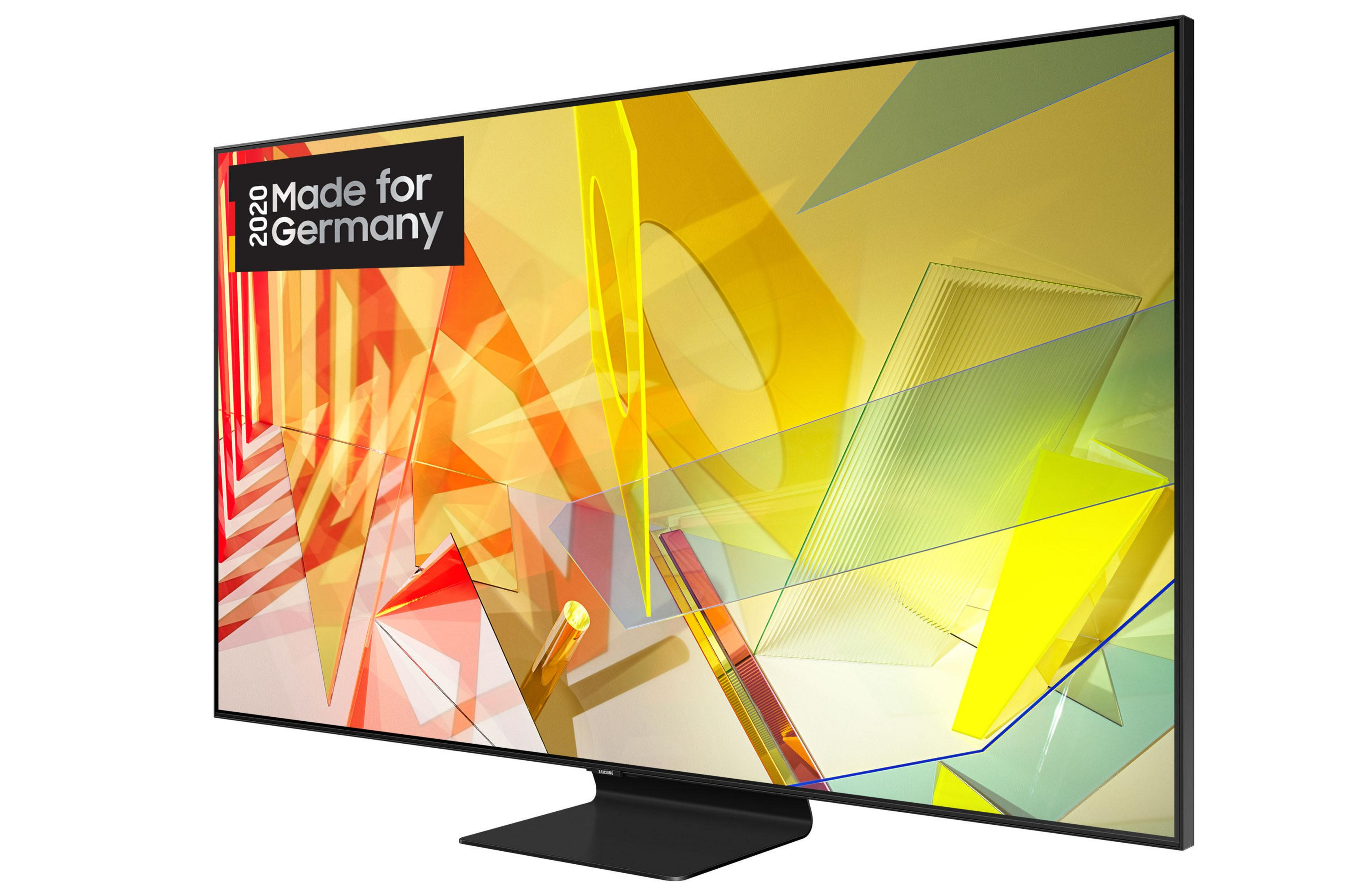 Ein Fernseher mit farbenfroher Anzeige. Der Fernseher ist schwarz und steht auf einem schwarzen Ständer.
