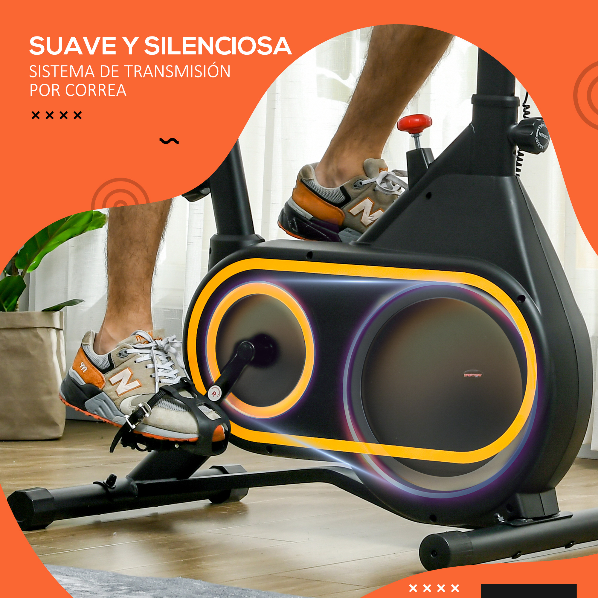 Persona usando bicicleta estática. La bicicleta es negra con detalles amarillos. Gráfico naranja.