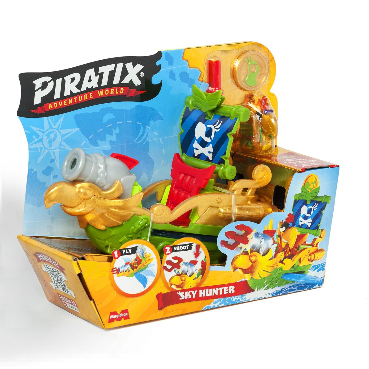 Barco pirata de juguete en una caja, diseño colorido con un cañón y un mascarón de proa dorado.