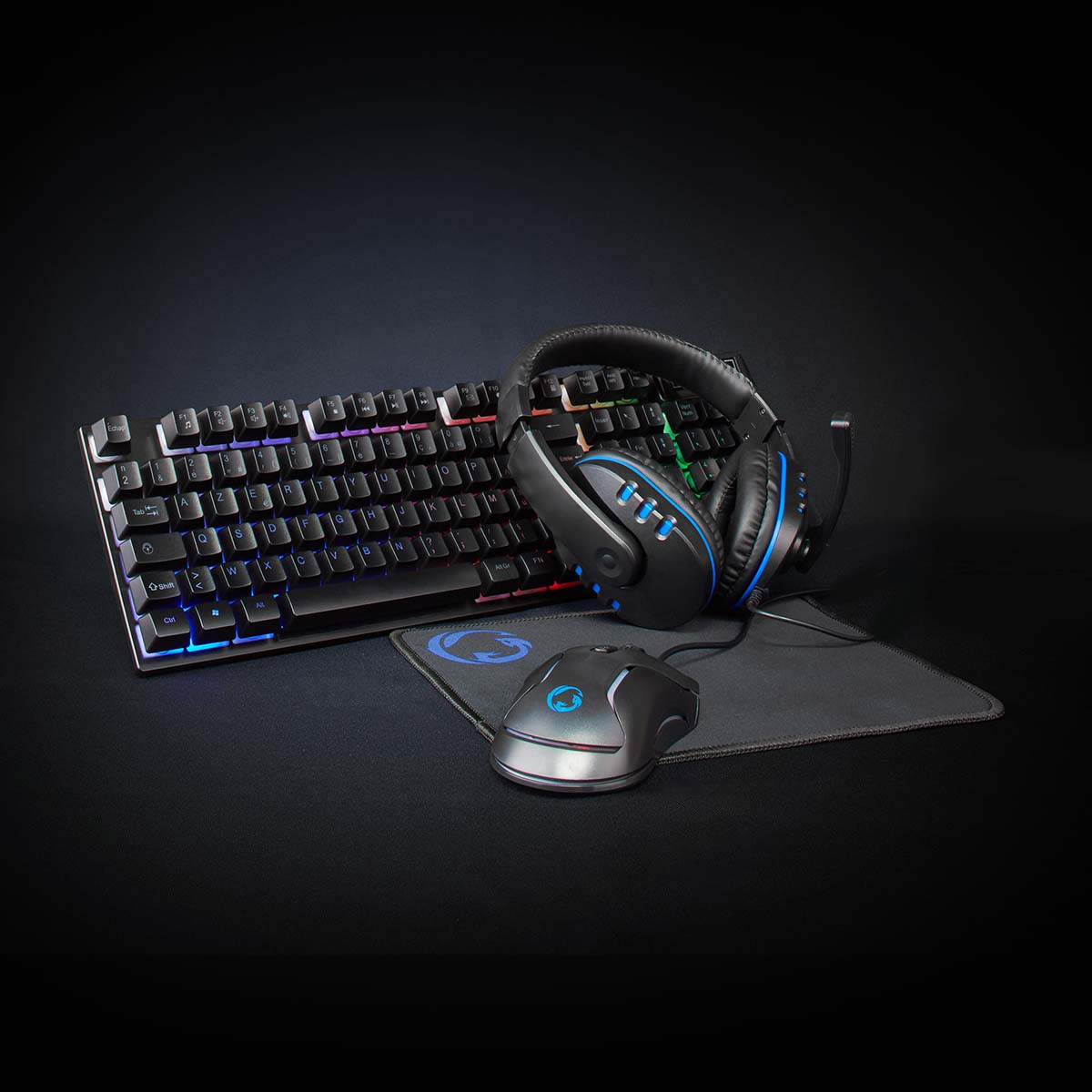Black gaming setup with keyboard, headphones, mouse and mousepad.