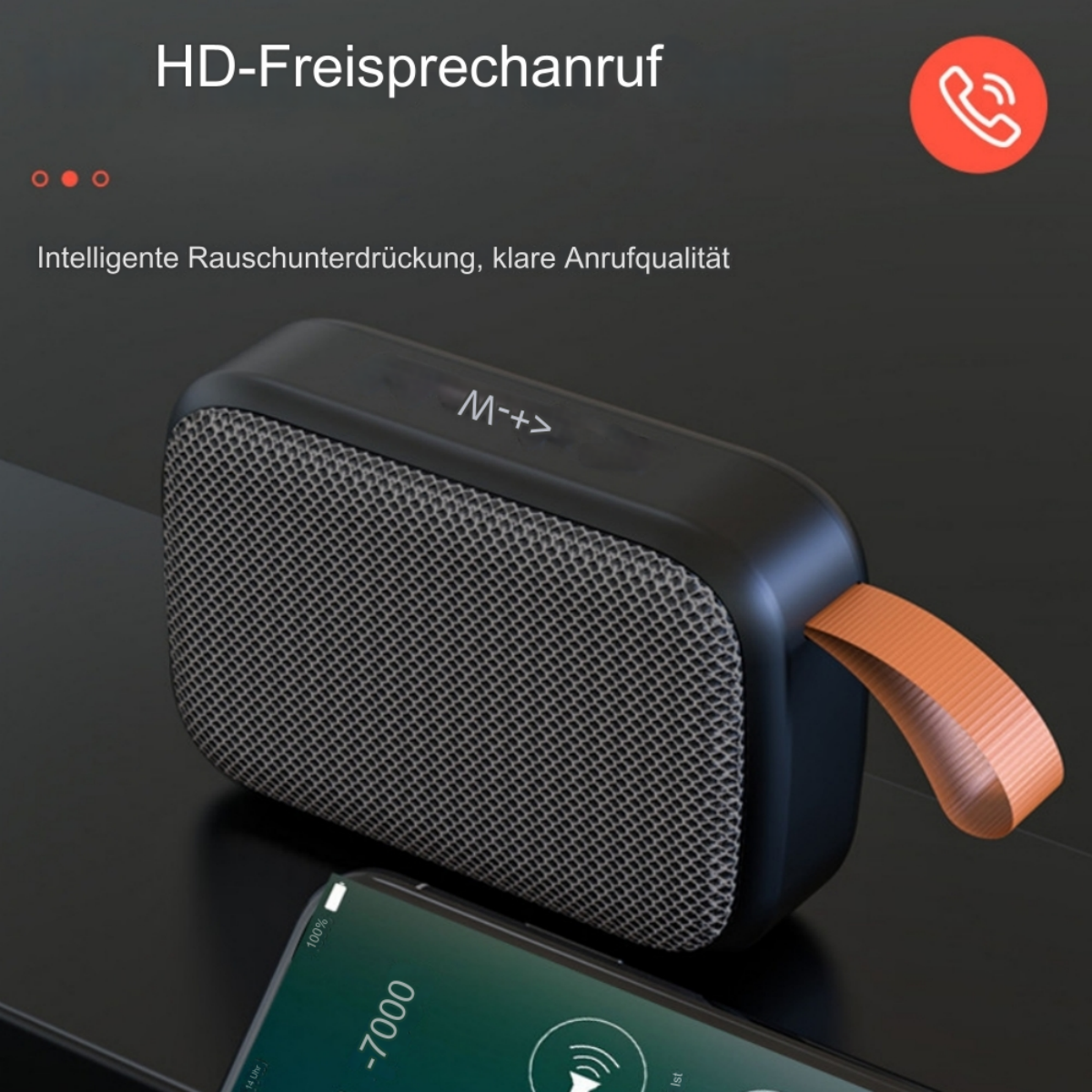 Schwarzer und grauer Lautsprecher mit orangefarbenem Griff. Ein Telefon mit Musik auf dem Bildschirm darunter.