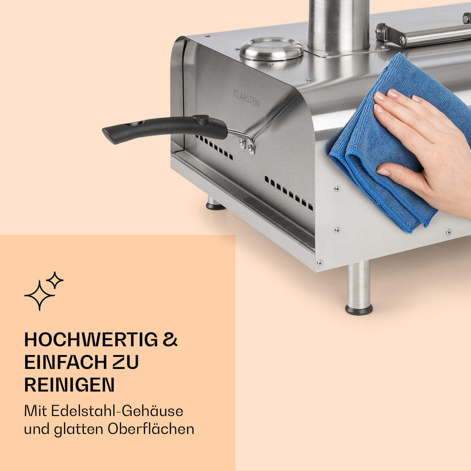 Edelstahlofen mit blauem Tuch, reinigt die Oberfläche. Text: Hochwertig und leicht zu reinigen.