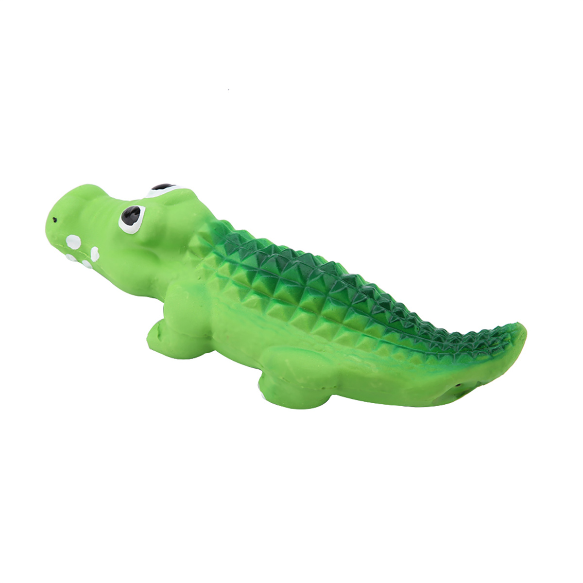Ein grüner Spielzeug-Alligator mit weißen Punkten und grünen dreieckigen Schuppen auf dem Rücken.