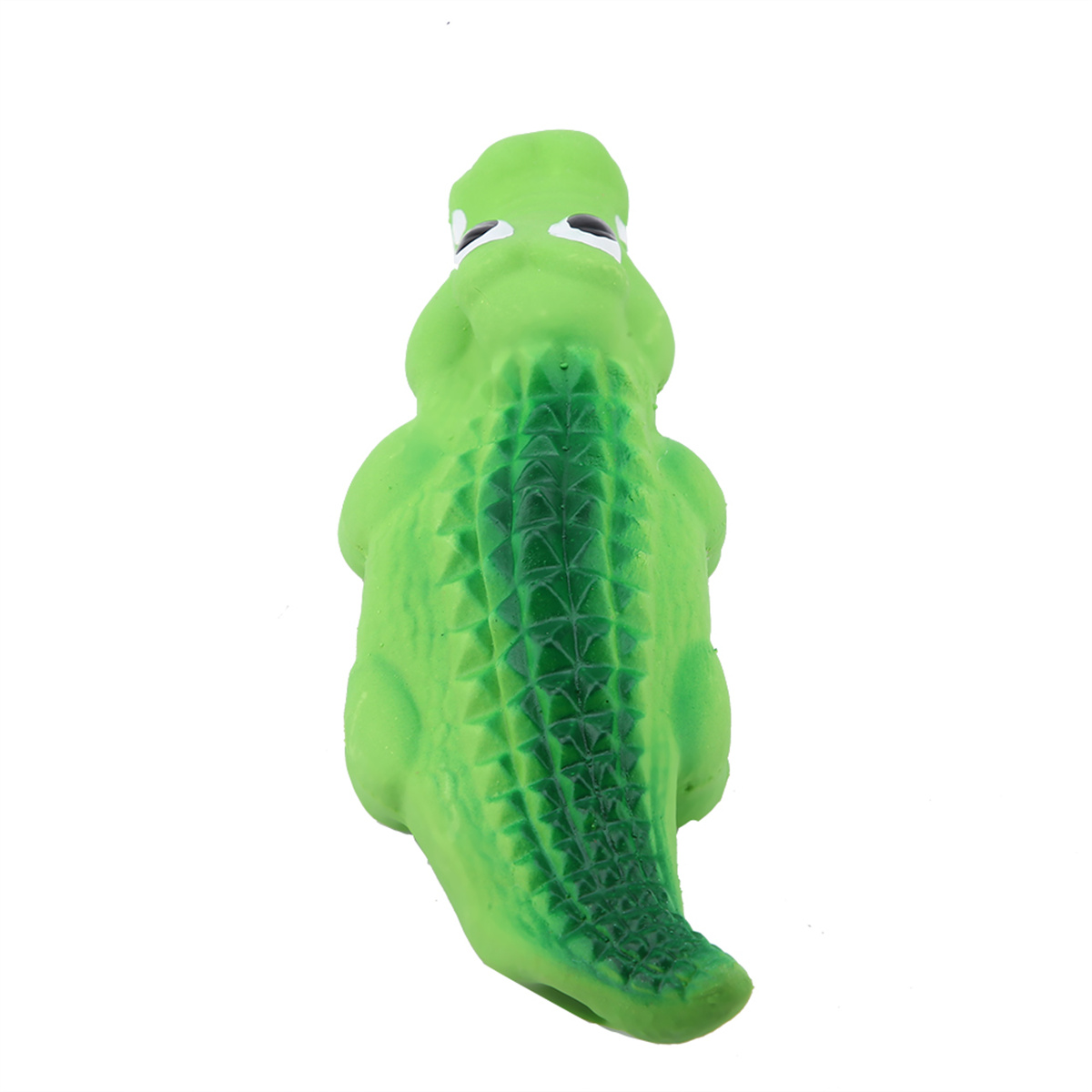 Grünes Spielzeug-Alligator mit geriffeltem Rücken und kleinen Augen. Weißer Hintergrund.