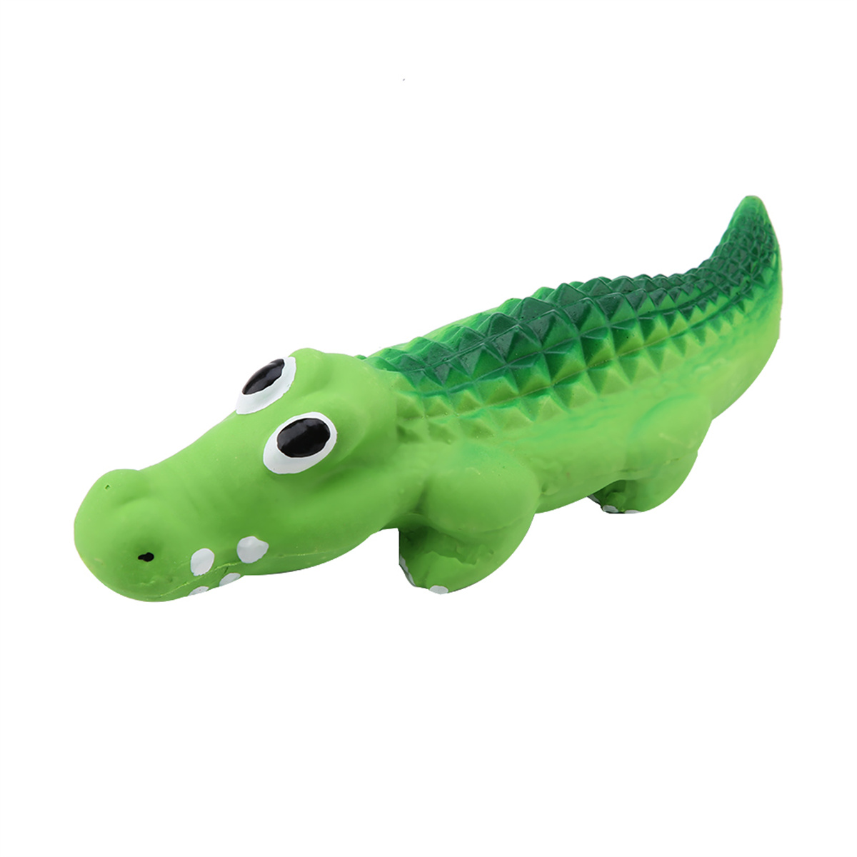 Grünes Spielzeugkrokodil mit weißen Zähnen und schwarzen Augen.