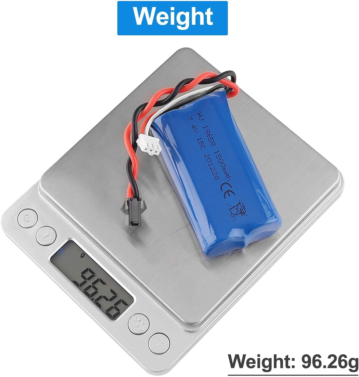 Silberne Waage mit einer blauen Batterie darauf. Drähte und ein Stecker sind angebracht.