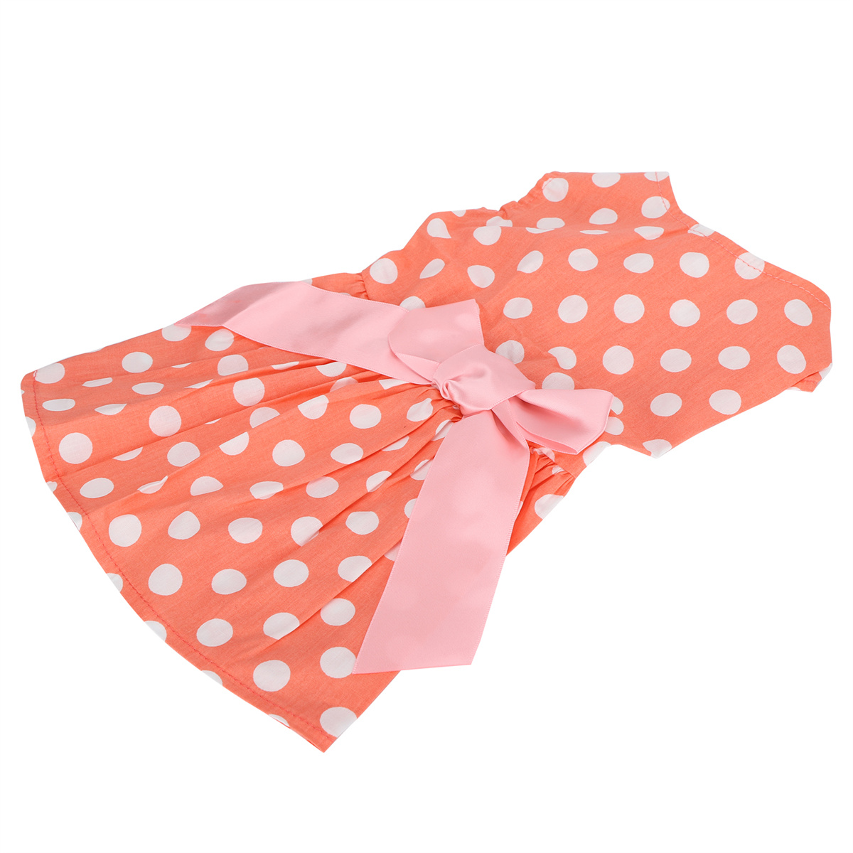Ein orangefarbenes Hundekleid mit weißen Punkten und einer rosa Schleife. Es ist angewinkelt. Der Hintergrund ist weiß.