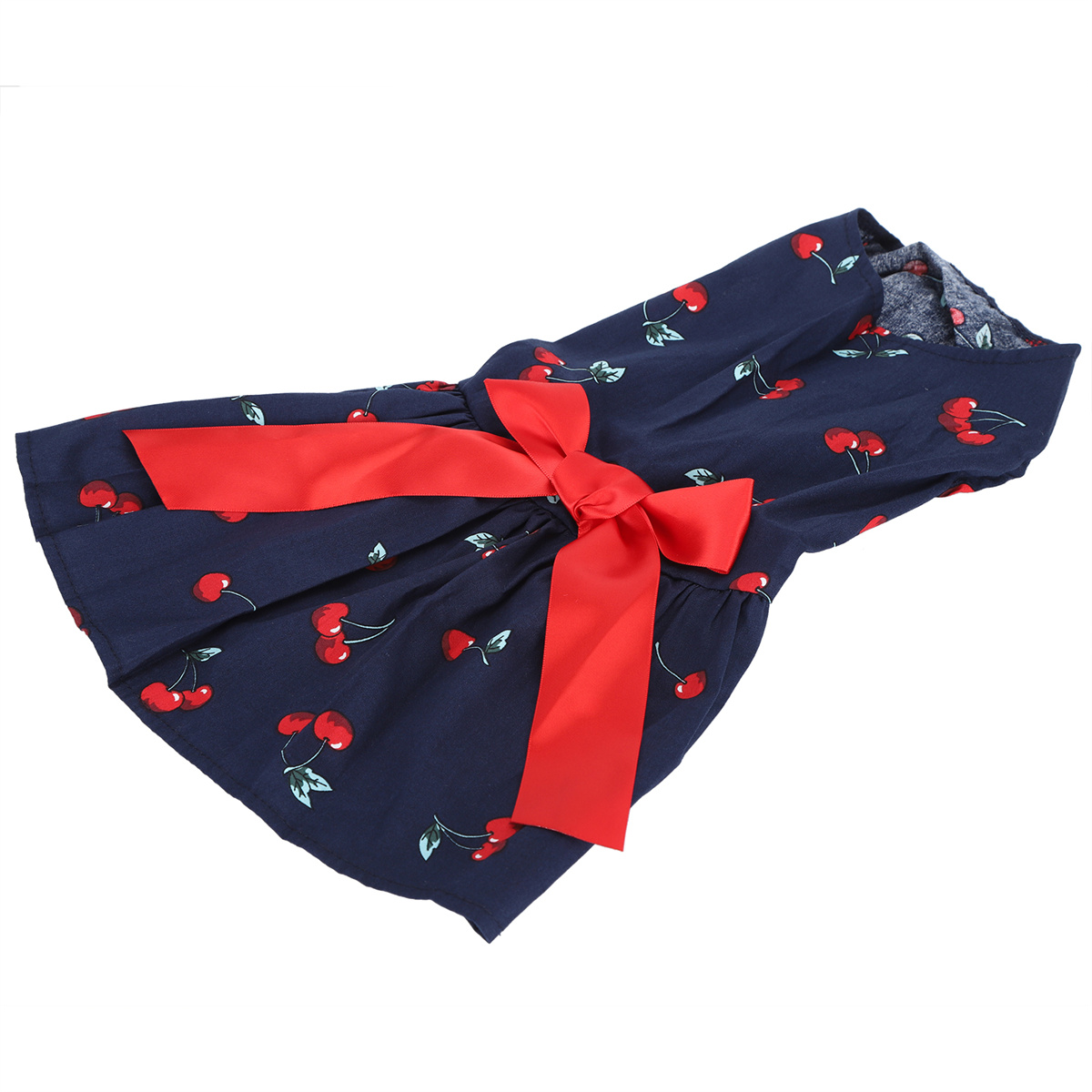 Ein blaues Hundekleid mit roter Schleife und Kirschmuster.