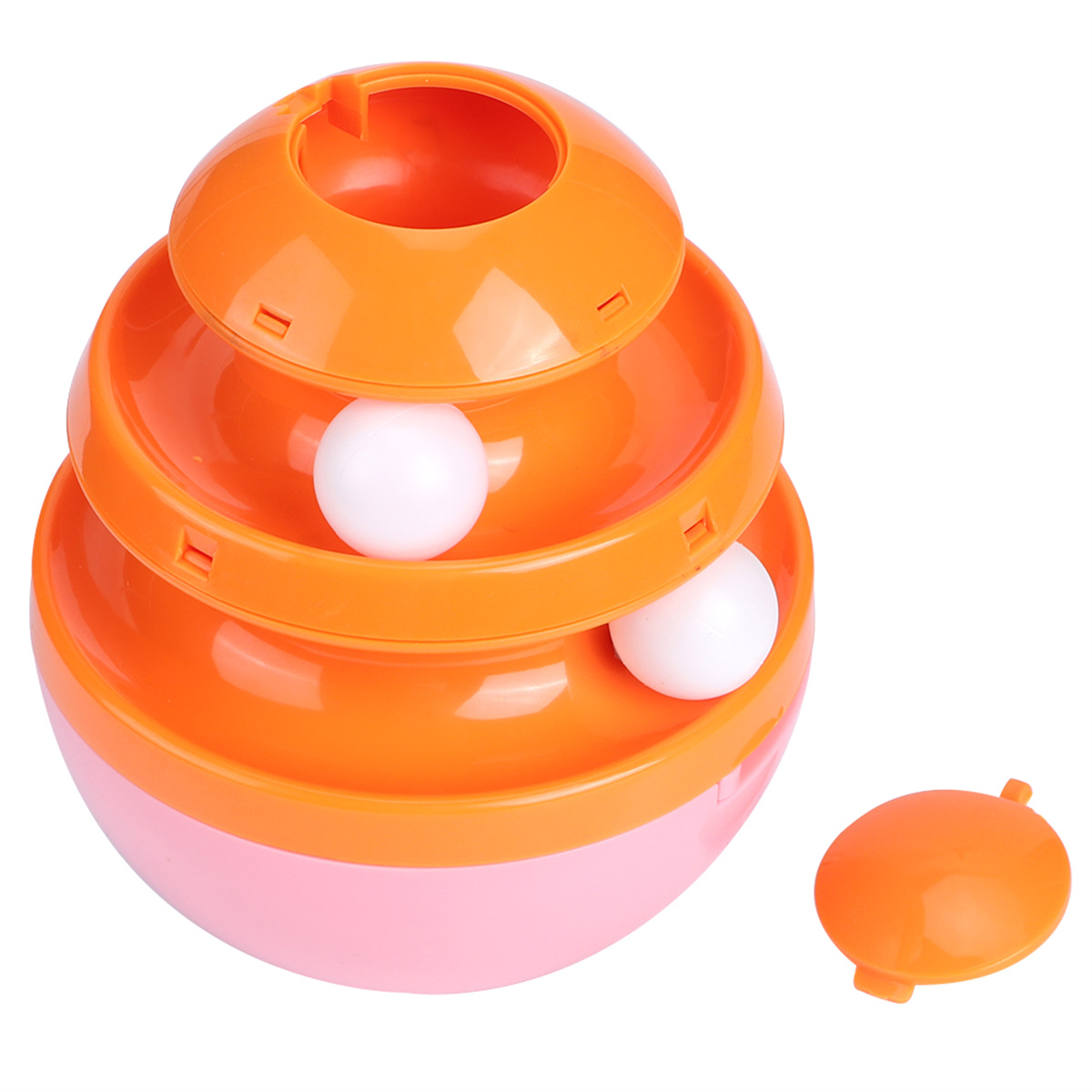 Orange-rosa Spielzeug mit weißen Kugeln, gestapelt. Runde Basis und orangefarbene Schichten.