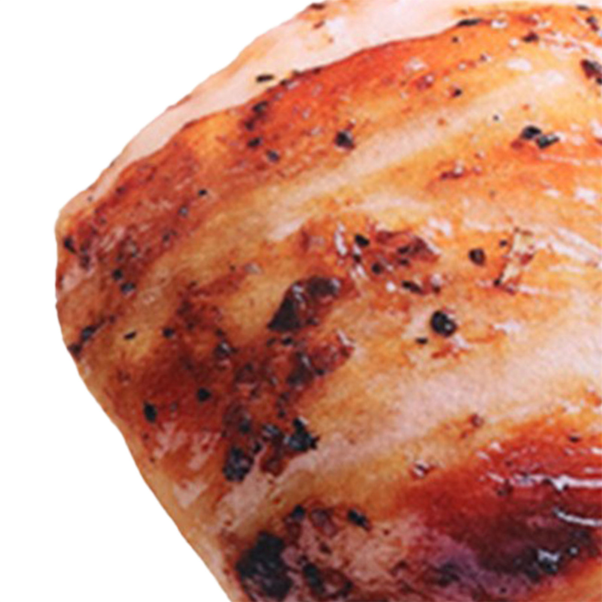 Nahaufnahme von gegrilltem Fleisch mit dunkler, verkohlter Oberfläche.