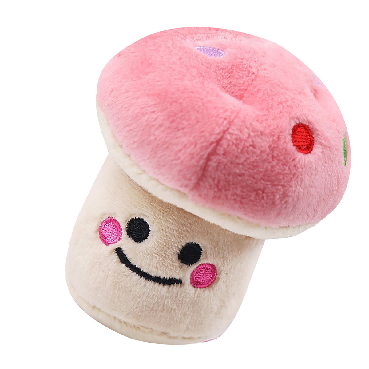 Ein Plüschpilz-Spielzeug. Die Oberseite ist rosa mit lila Punkten, der Stiel ist beige und hat ein lächelndes Gesicht.